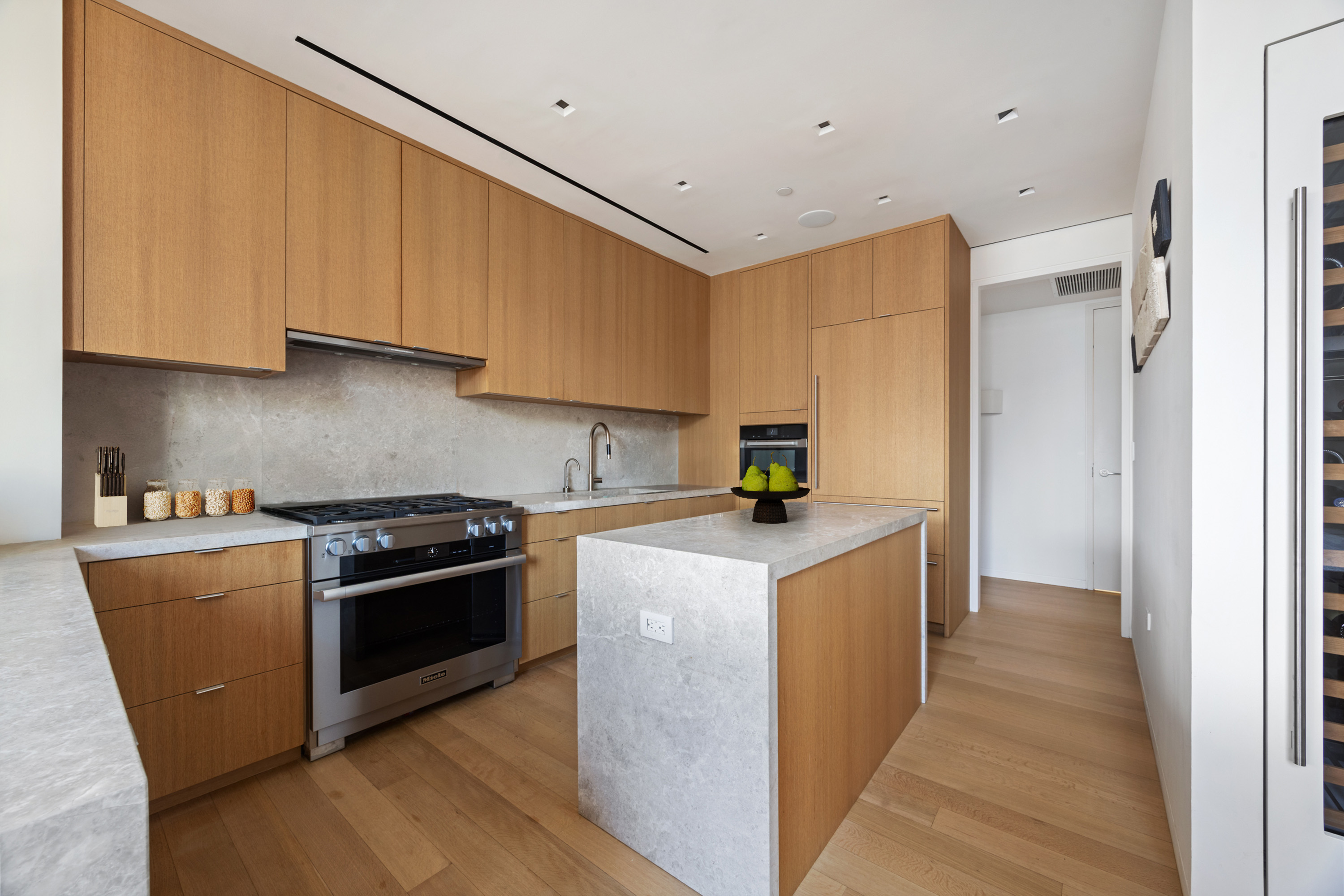 350 West Broadway, Unit 7FL Manhattan, NY 10013 - Photo 5 of 17 a kitchen with stainless steel appliances granite countertop a stove a sink and a refrigerator