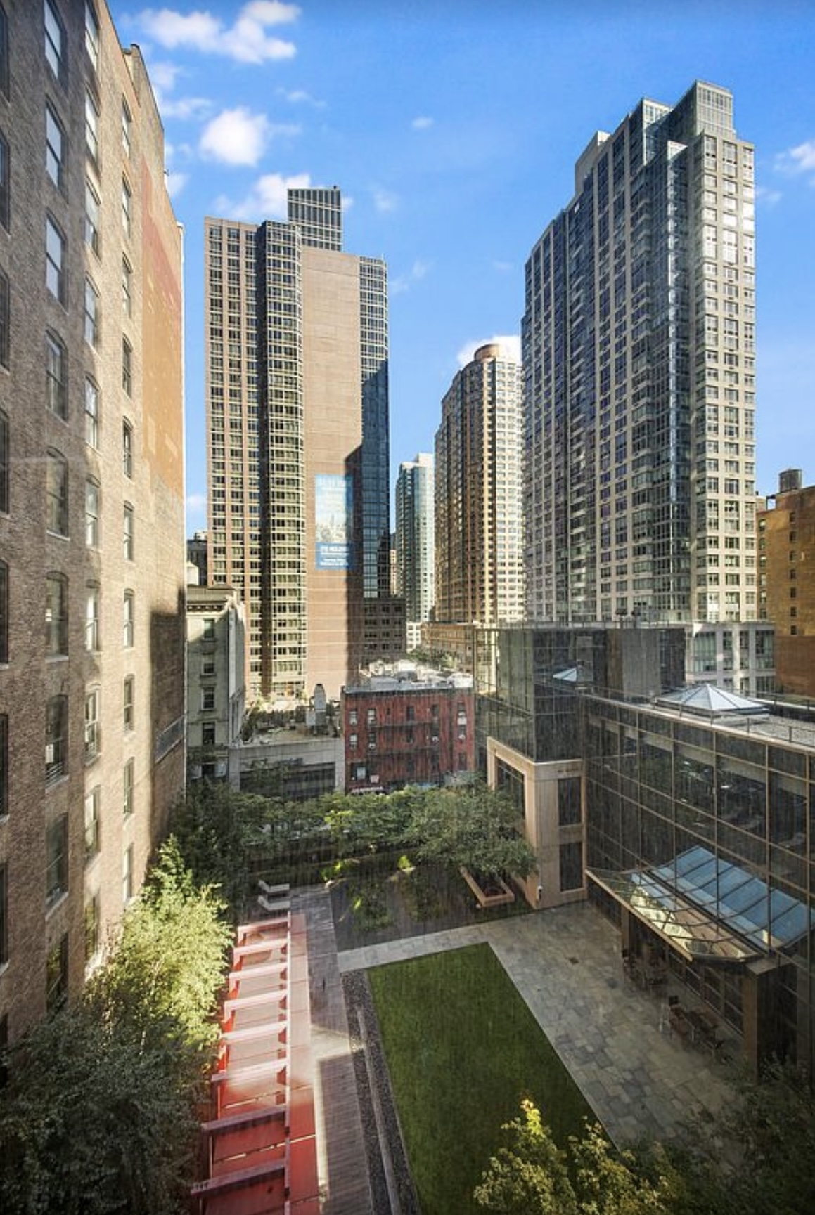101 West 24th Street, Unit 7A Manhattan, NY 10011 - Photo 12 of 13 a view of a city with tall buildings