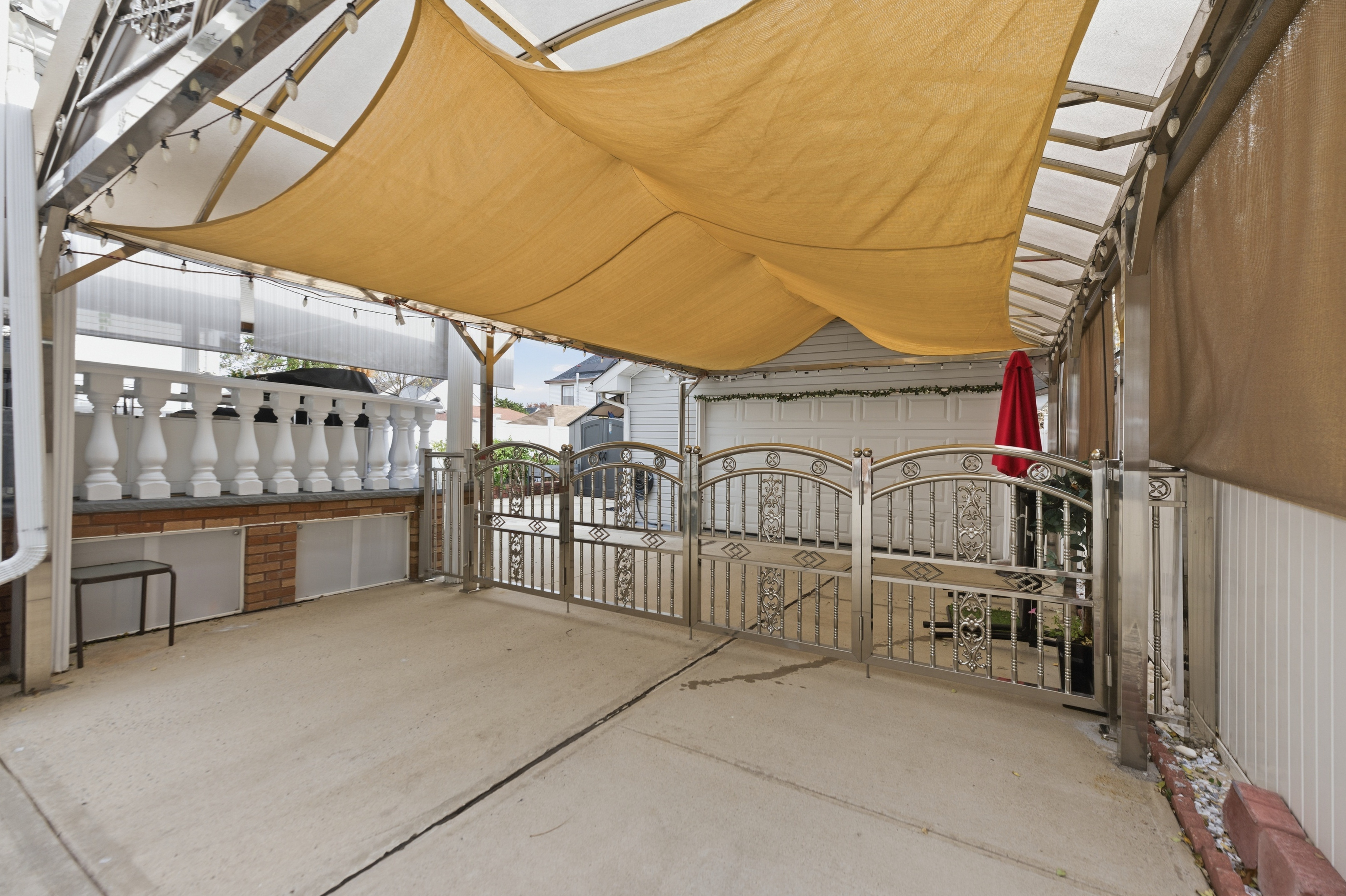 150-22 114th Road Queens, NY 11434 - Photo 20 of 22 a view of a patio with a table and chairs
