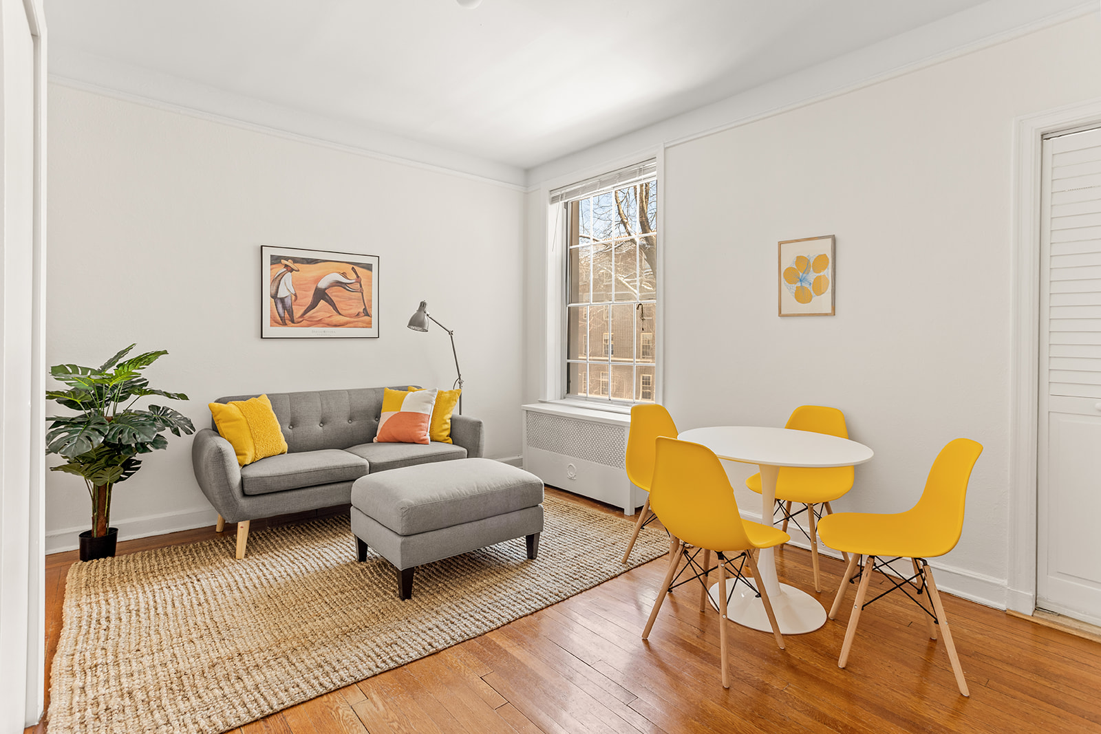 37-51 84th Street, Unit 21 Queens, NY 11372 - Photo 1 of 10 a living room with furniture and a window