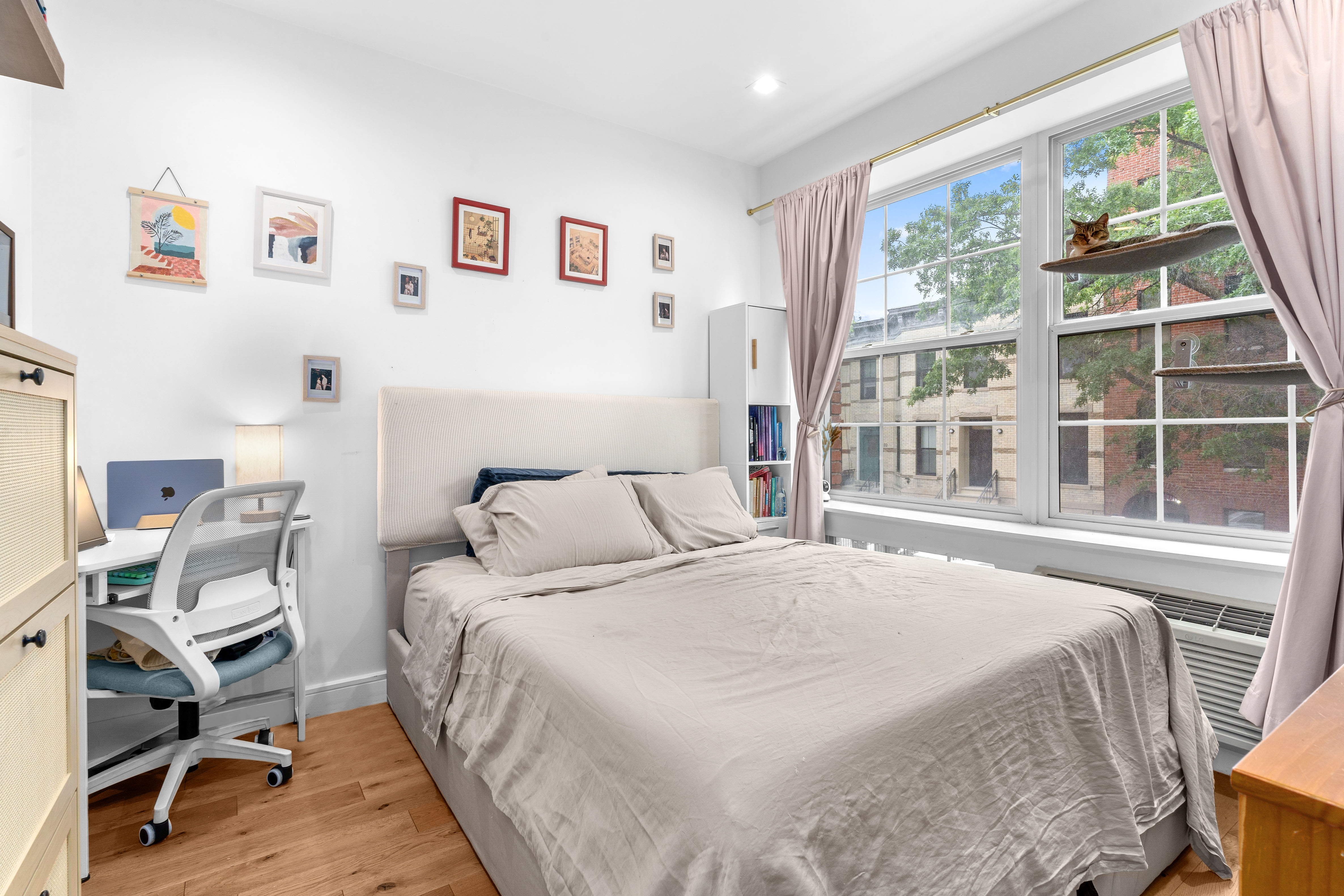 1229 Putnam Avenue, Unit 2A Brooklyn, NY 11221 - Photo 1 of 10 a bedroom with a bed and a window