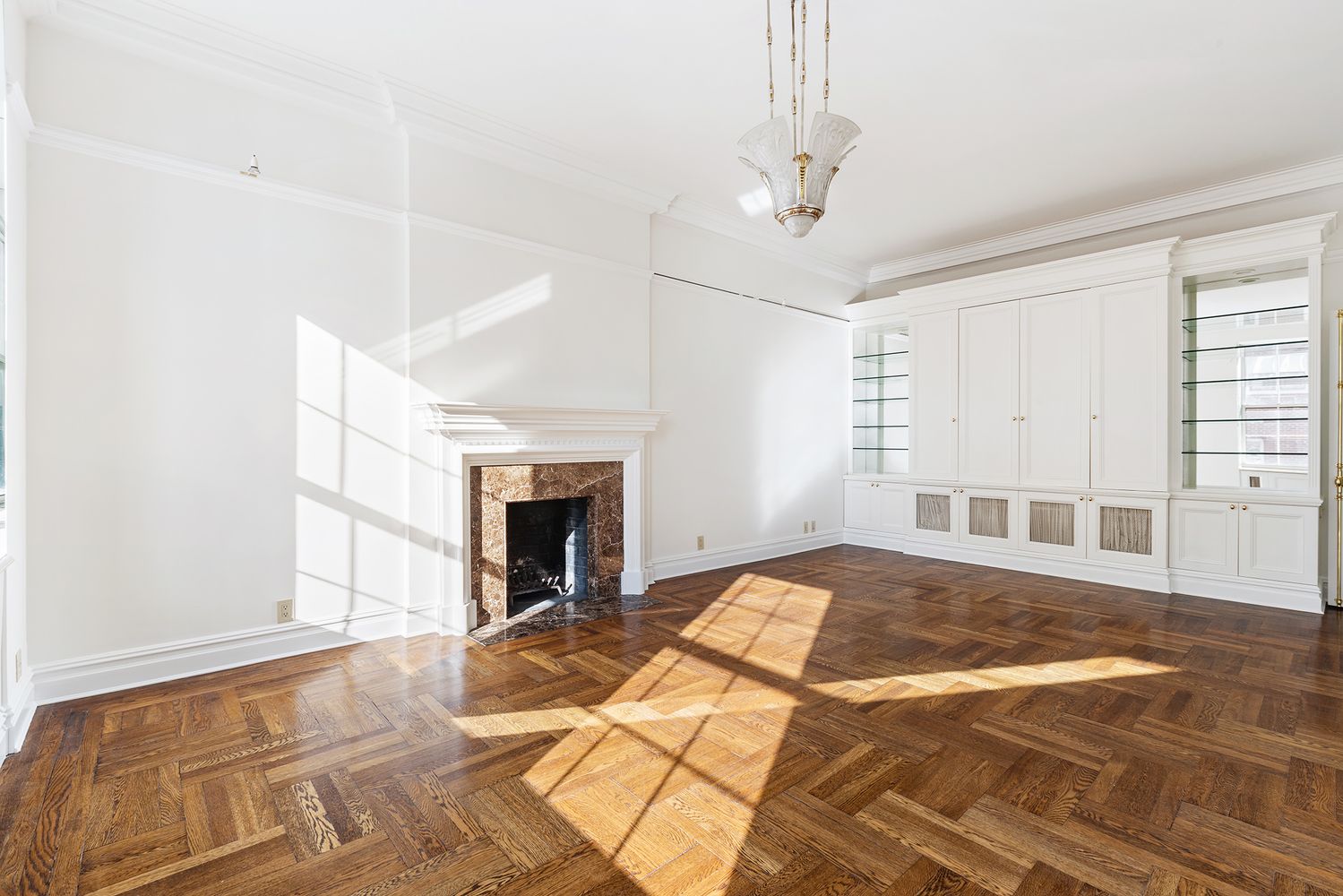 30 Sutton Place, Unit 14B Manhattan, NY 10022 - Photo 2 of 10 a bed room with a bed and a fireplace