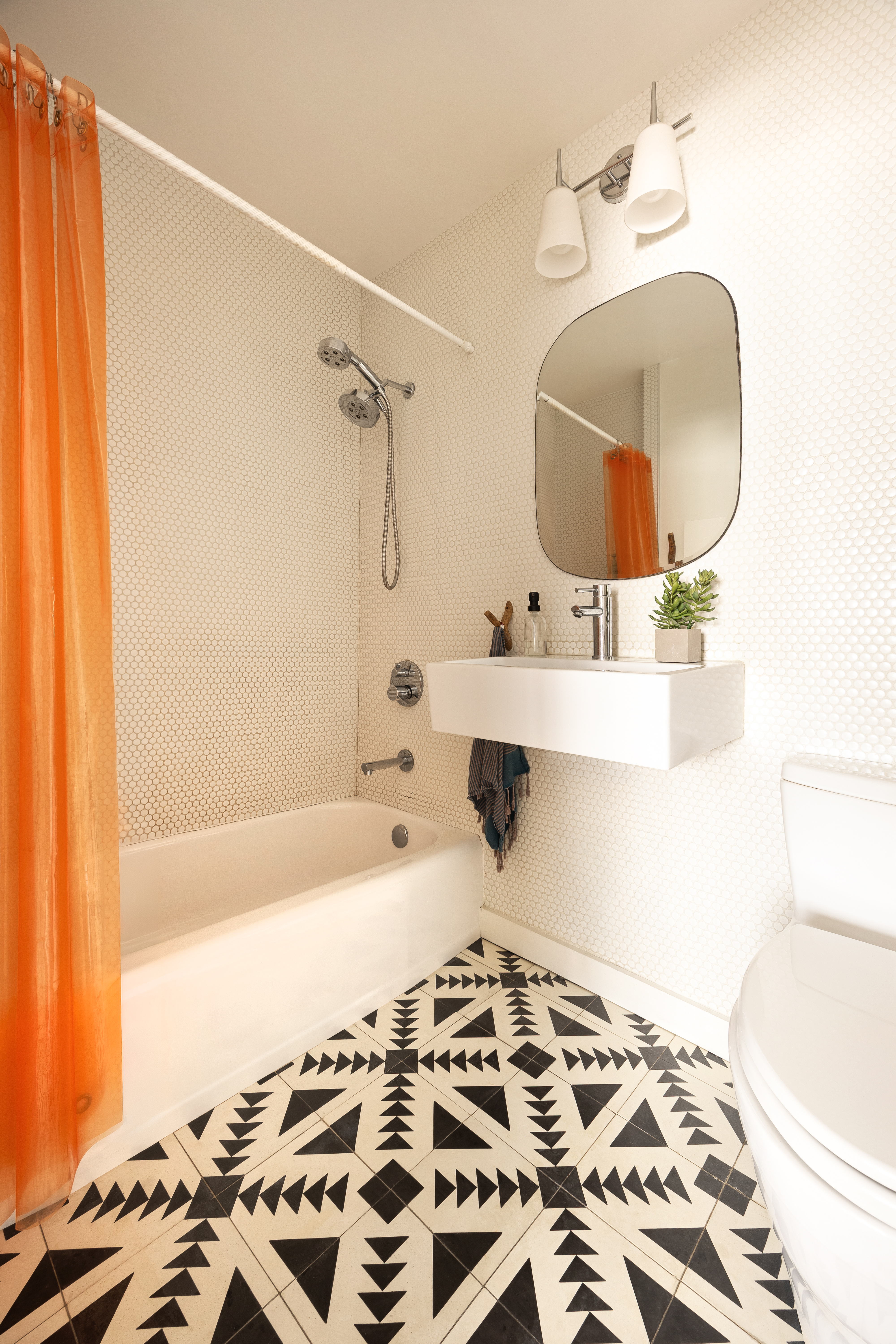 85 Livingston Street, Unit 16N Brooklyn, NY 11201 - Photo 8 of 9 a bathroom with a sink and a bathtub