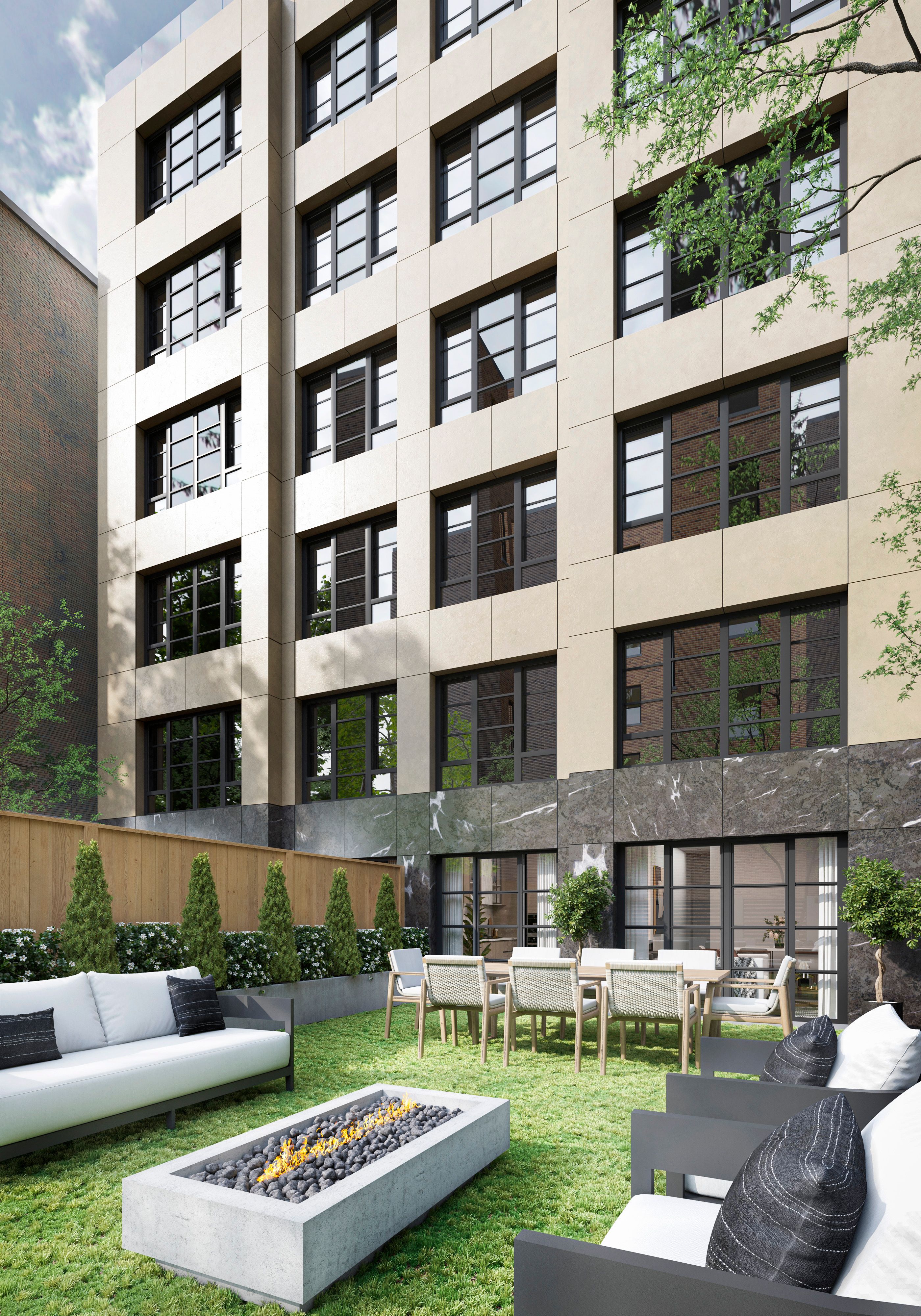 a view of a building with a yard and a fireplace