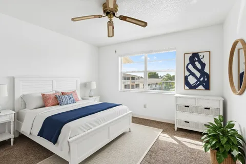 a view of a chairs and table in patio