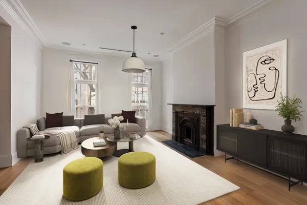 a living room with furniture and a fireplace