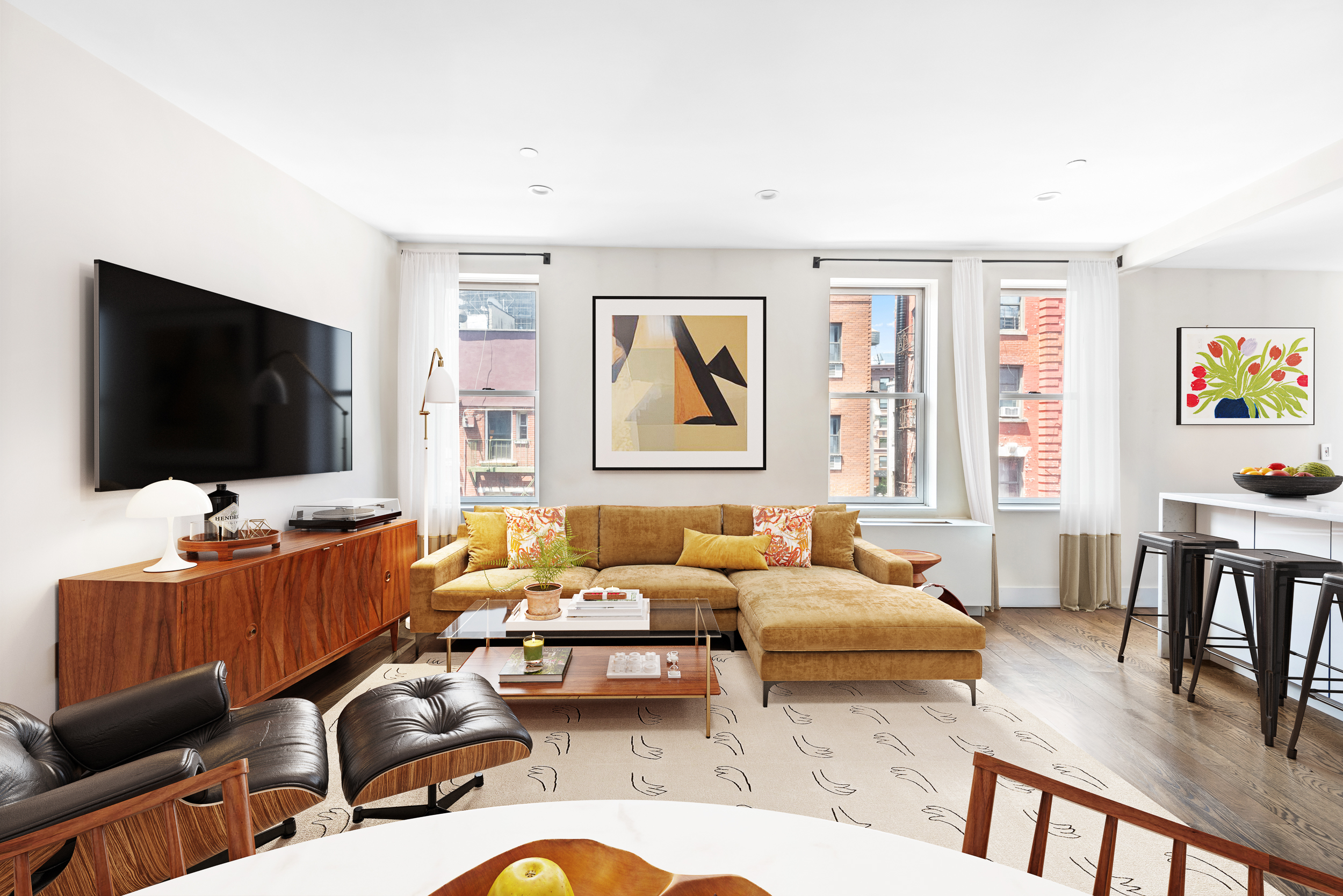 176 Mulberry Street, Unit 5 Manhattan, NY 10013 - Photo 3 of 12 a living room with furniture and a flat screen tv