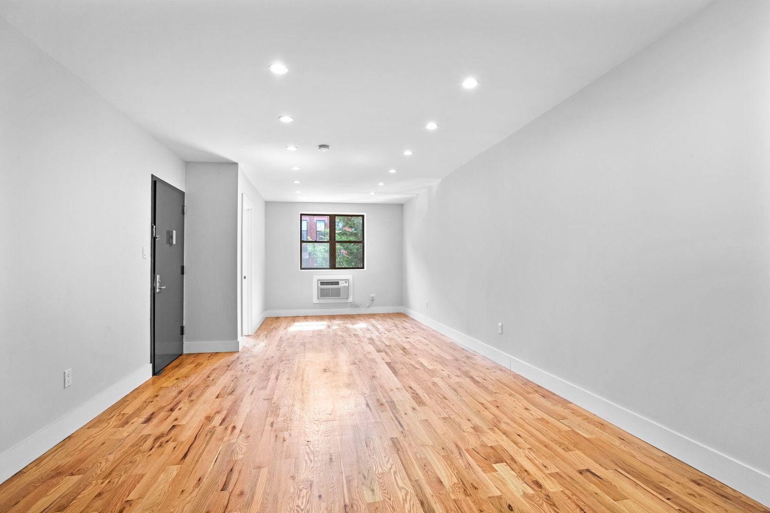 791 Lexington Avenue, Unit 2 Brooklyn, NY 11221 - Photo 3 of 19 a view of empty room with wooden floor