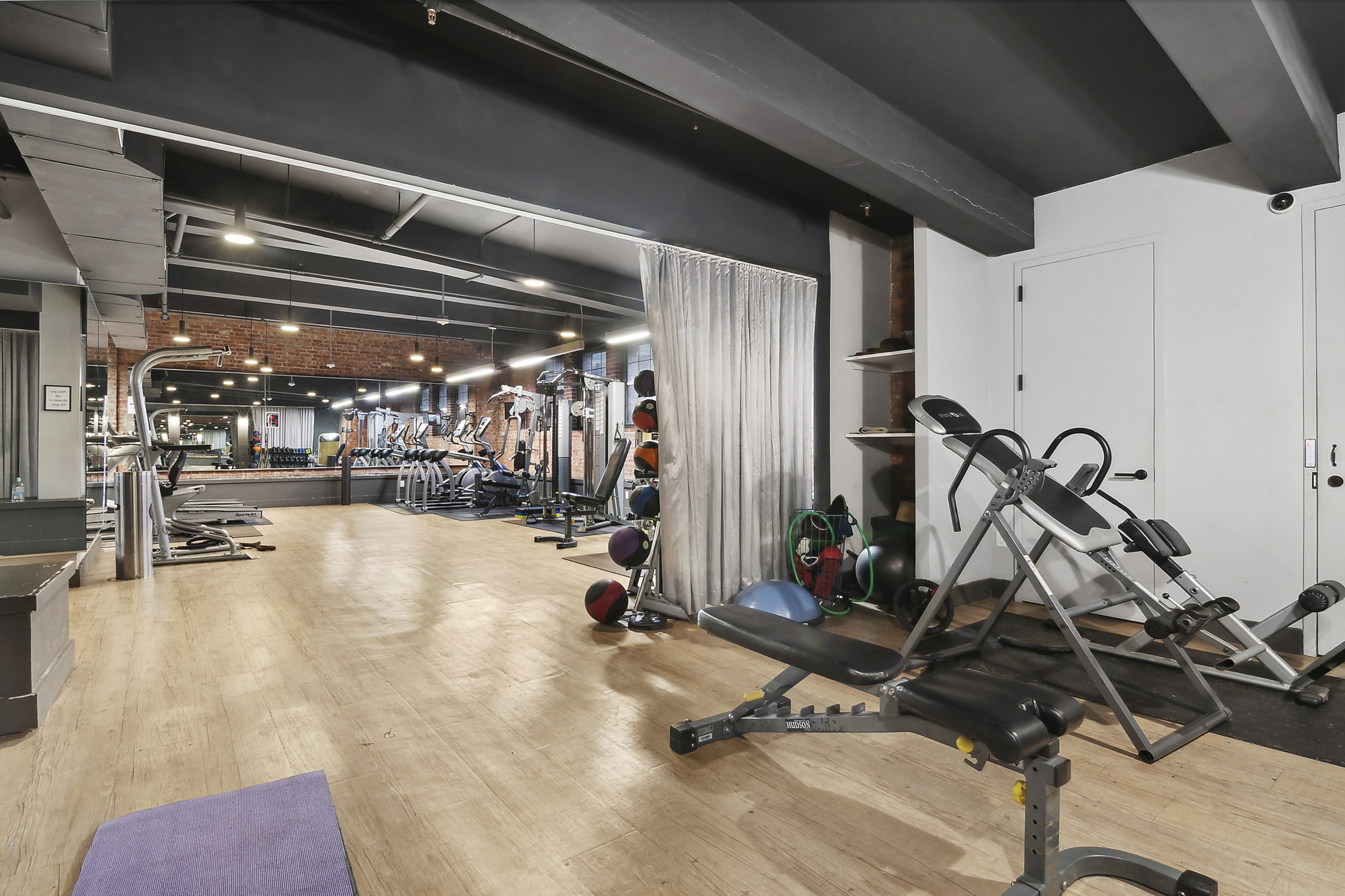 180 Bainbridge Street, Unit 305 Brooklyn, NY 11233 - Photo 15 of 23 a view of a room with gym equipment