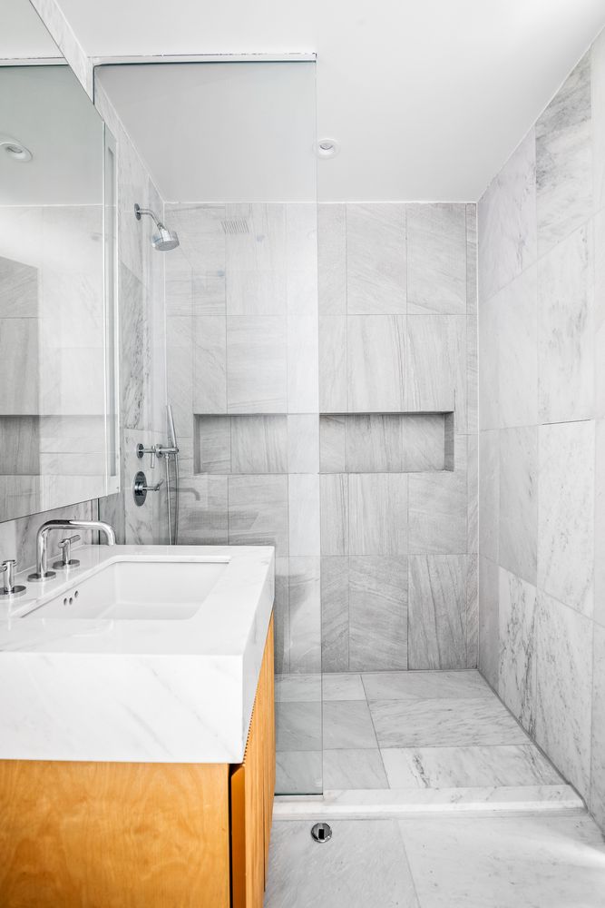 300 West 30th Street, Unit 11E Manhattan, NY 10001 - Photo 4 of 10 a bathroom with a sink and a shower