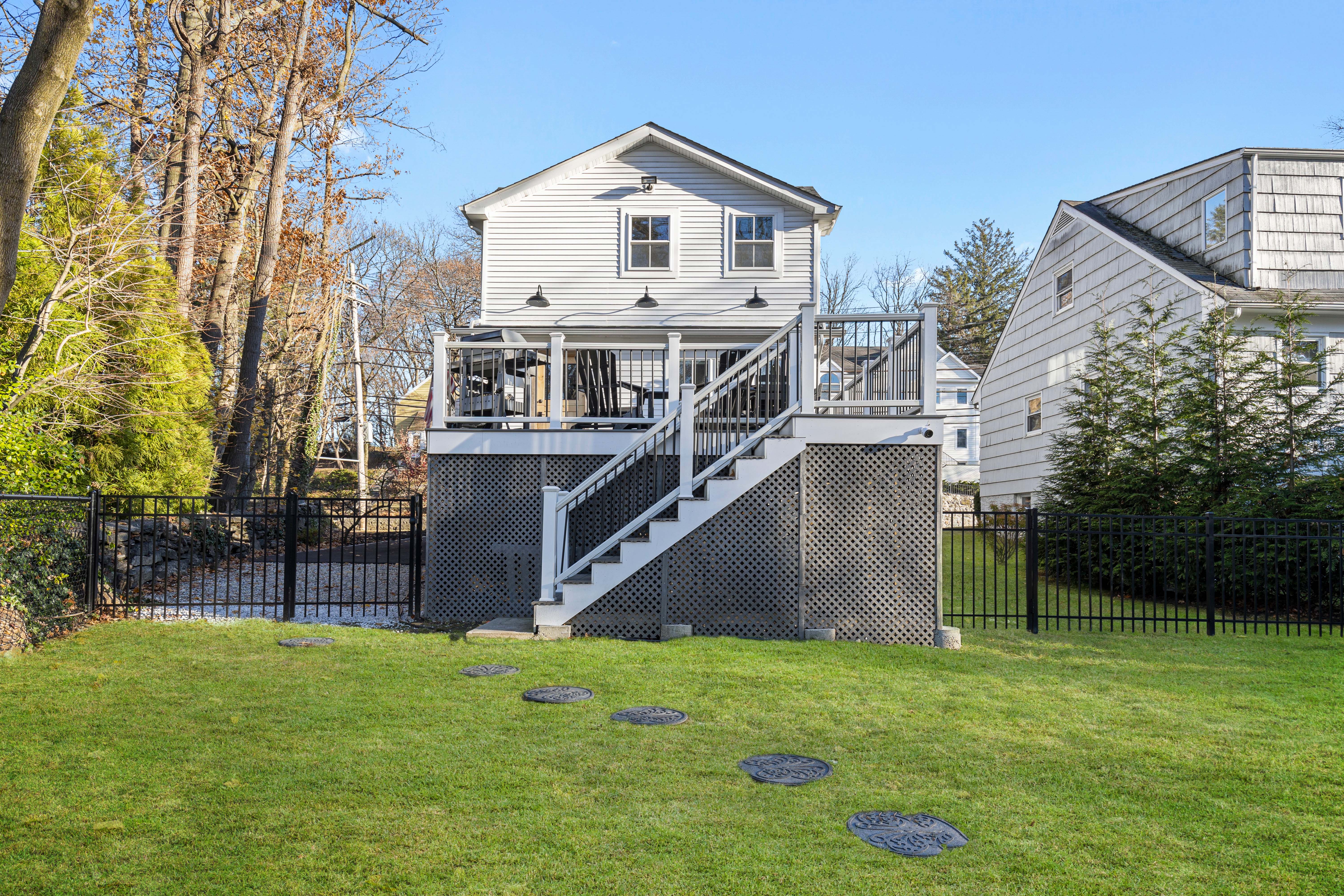 467 Midland Avenue Rye, NY 10580 - Photo 16 of 19 a front view of a house with garden