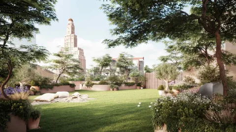 a view of a city with tall trees