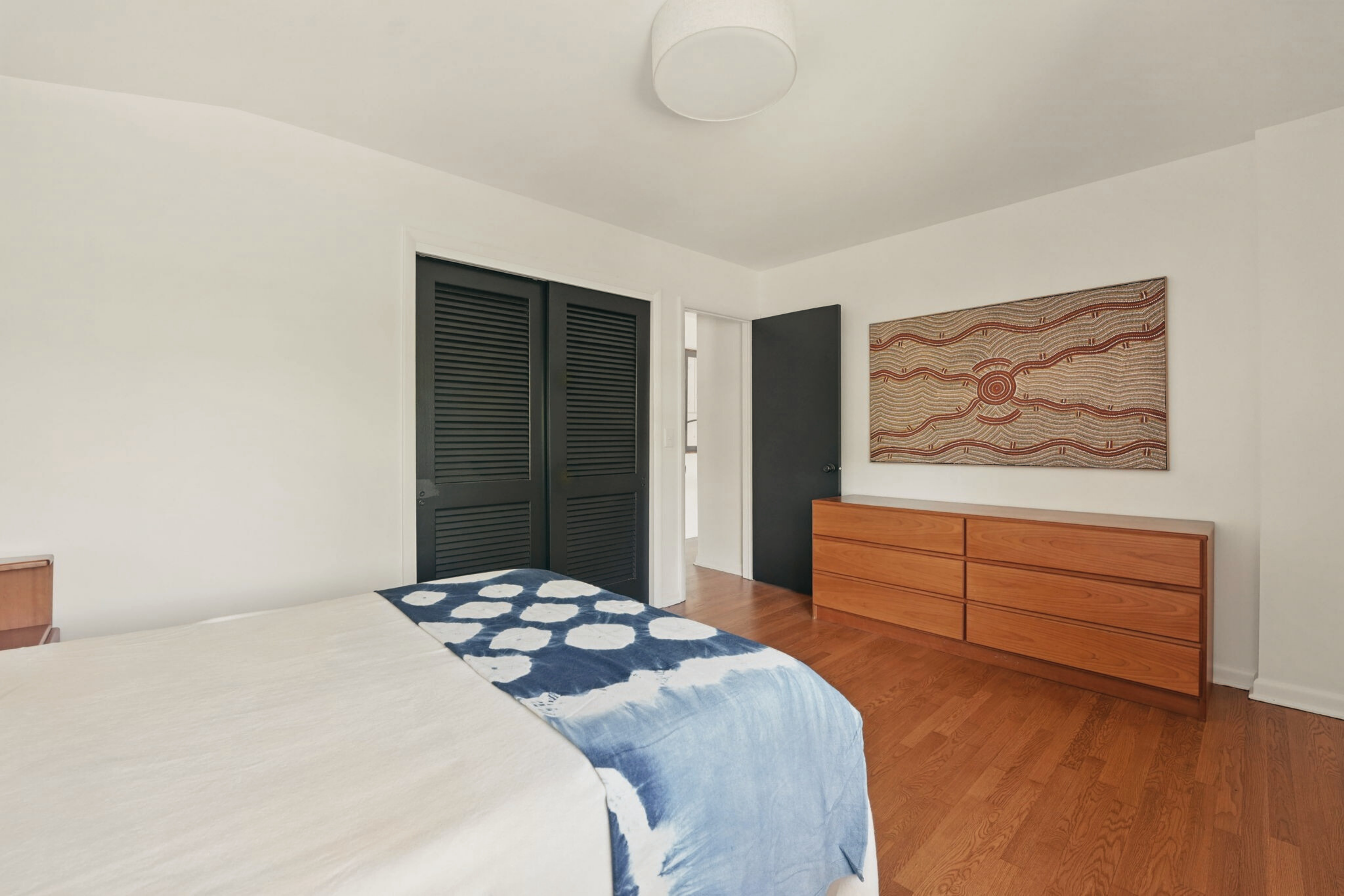 8003 16th Street Northwest Washington, DC 20012 - Photo 29 of 38 a bedroom with a bed and a painting on the wall