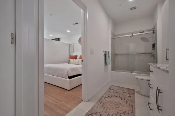 a bathroom with a bathtub and a shower