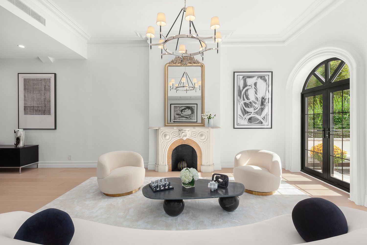 222 East 61st Street Manhattan, NY 10065 - Photo 20 of 28 a living room with furniture and a large window