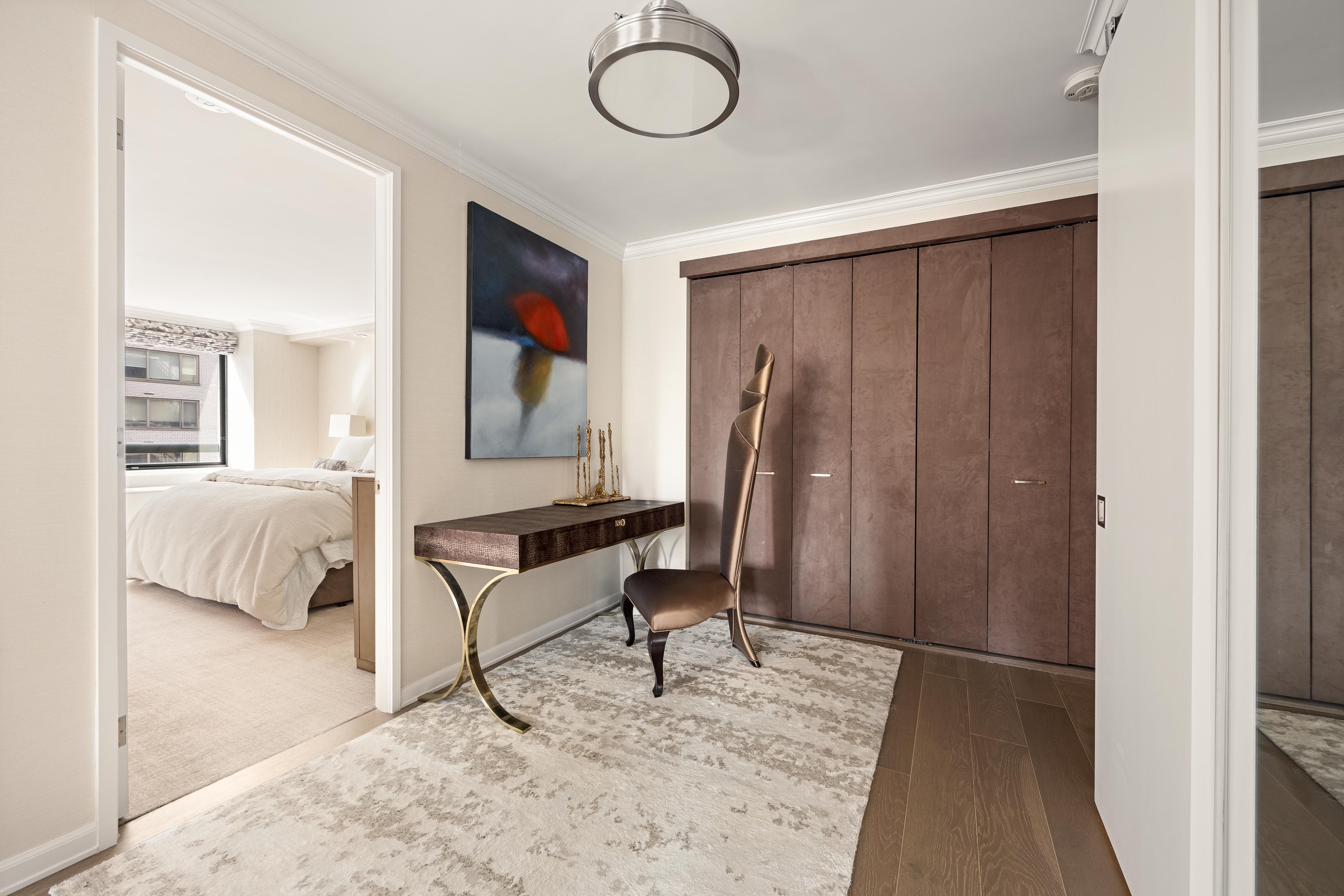 171 East 84th Street, Unit 7B Manhattan, NY 10028 - Photo 9 of 19 a living room with furniture a desk and chair with wooden floor