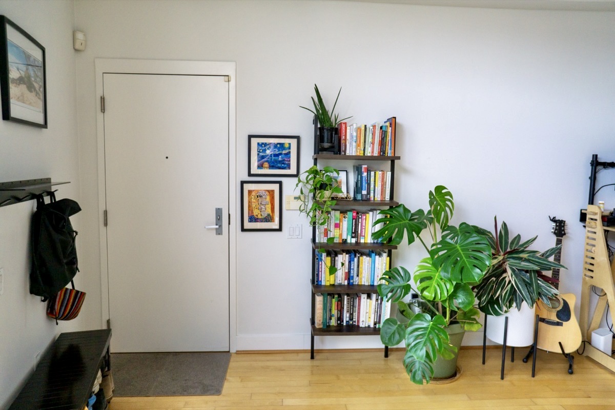 2426 Ontario Road Northwest, Unit 401 Washington, DC 20009 - Photo 13 of 28 a living room with furniture potted plant and a window
