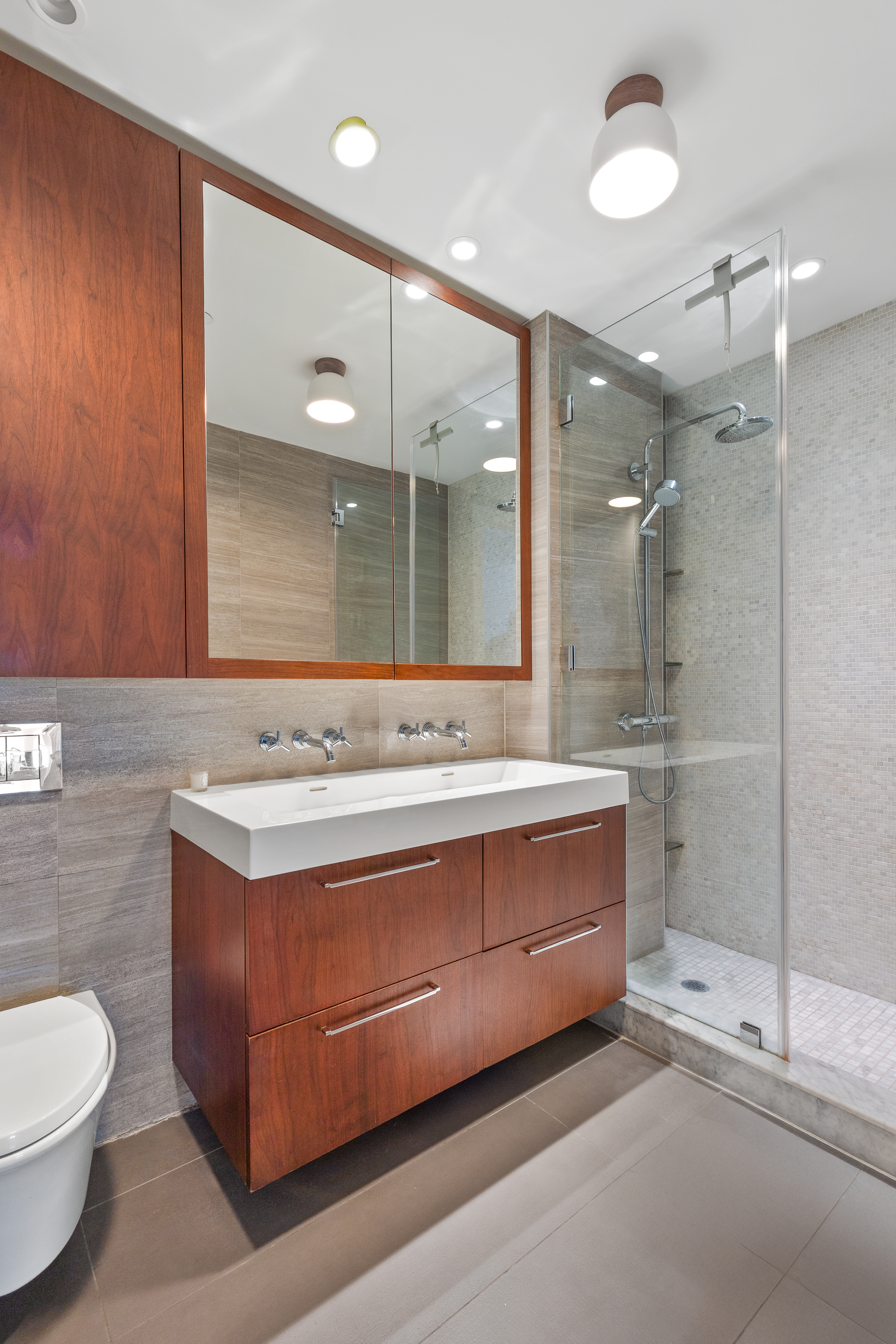 47 Bridge Street, Unit 5D Brooklyn, NY 11201 - Photo 7 of 21 a bathroom with a double vanity sink mirror and toilet