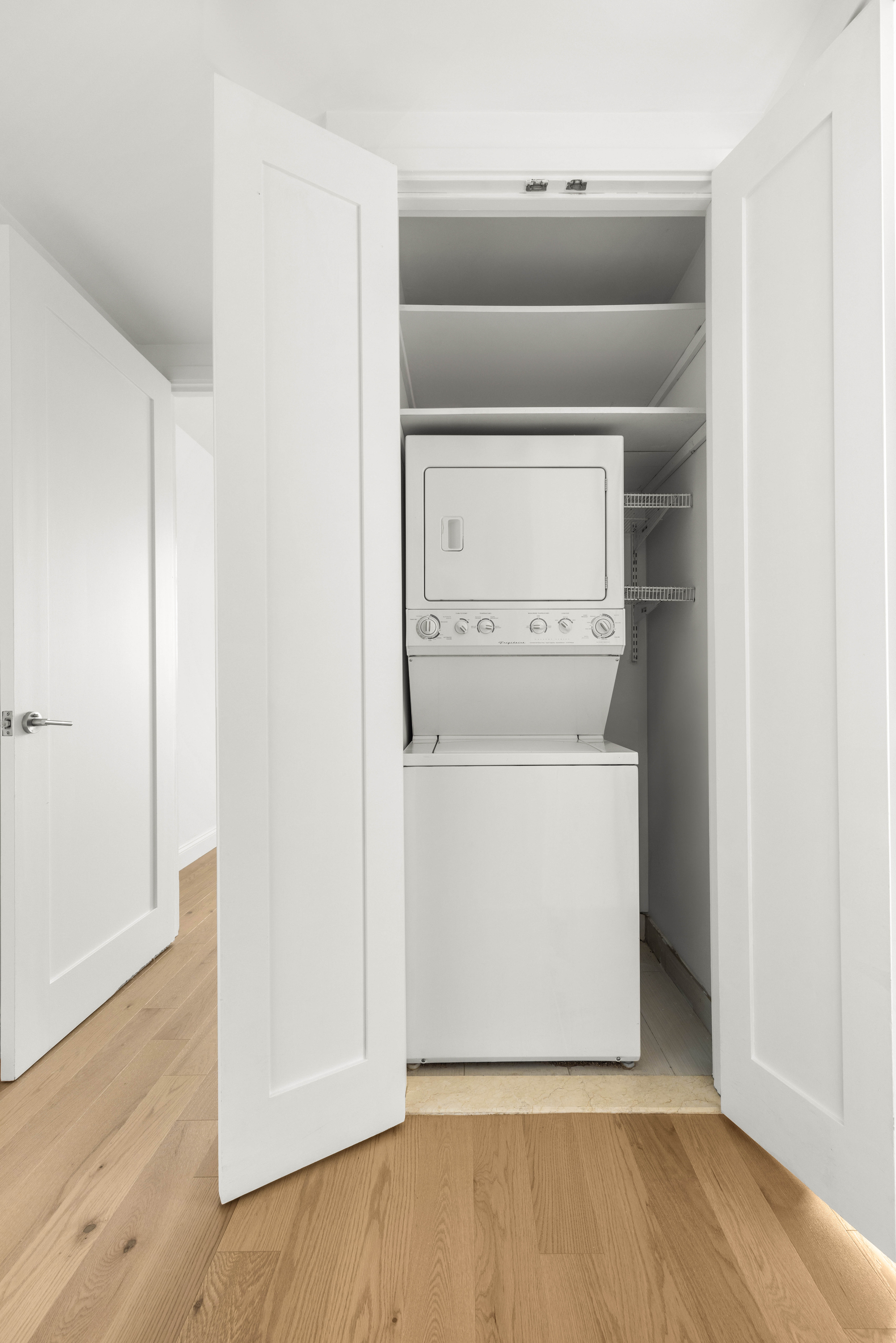 162 16th Street, Unit 7E Brooklyn, NY 11215 - Photo 11 of 23 a utility room with wooden floor washer and dryer