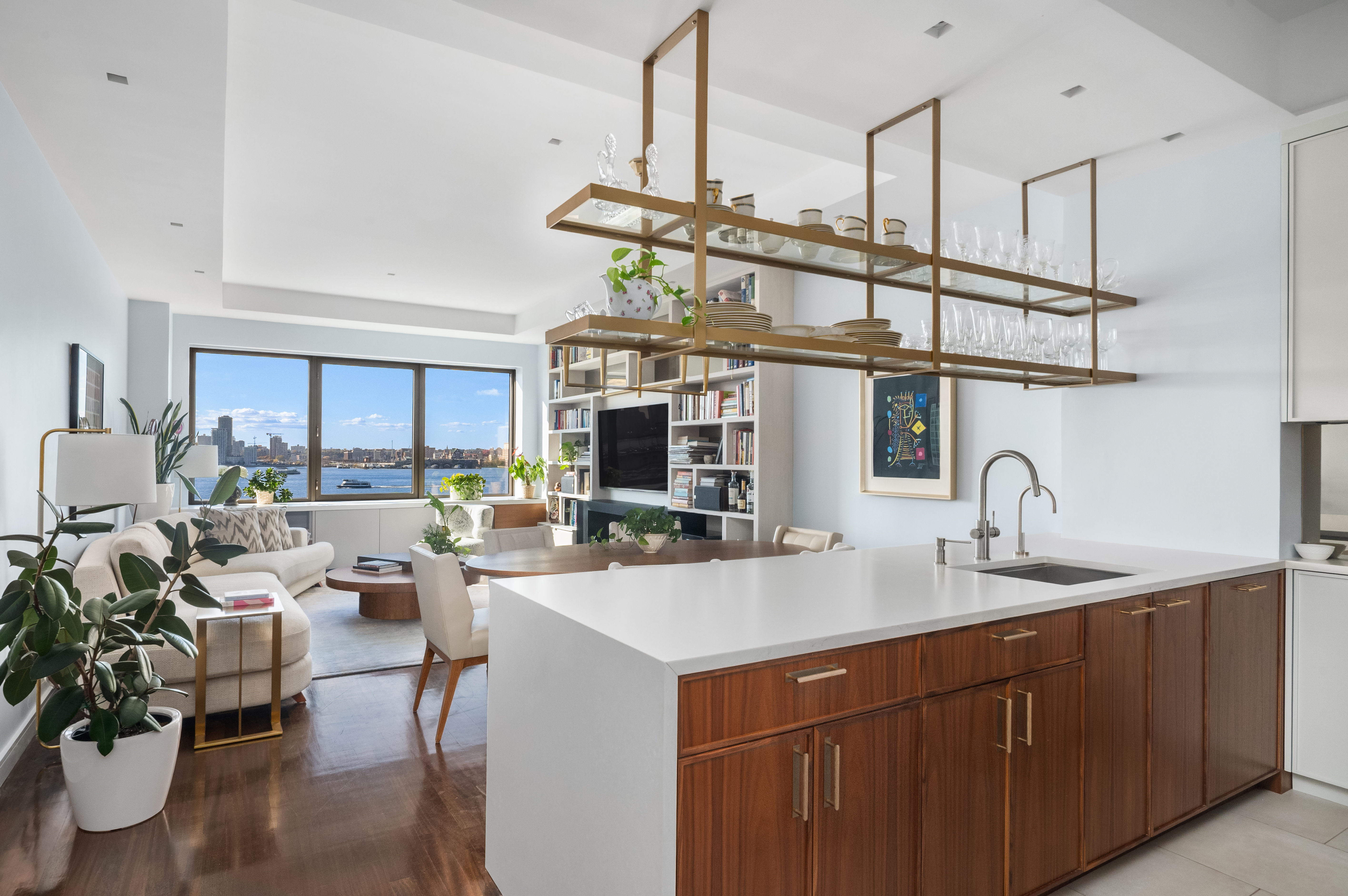 100 Morton Street, Unit 7EW Manhattan, NY 10014 - Photo 2 of 21 a kitchen with a sink a counter space appliances and cabinets