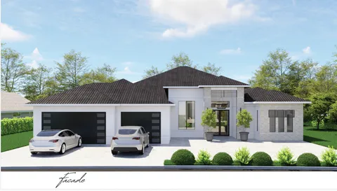 a view of a house with a small yard and potted plants