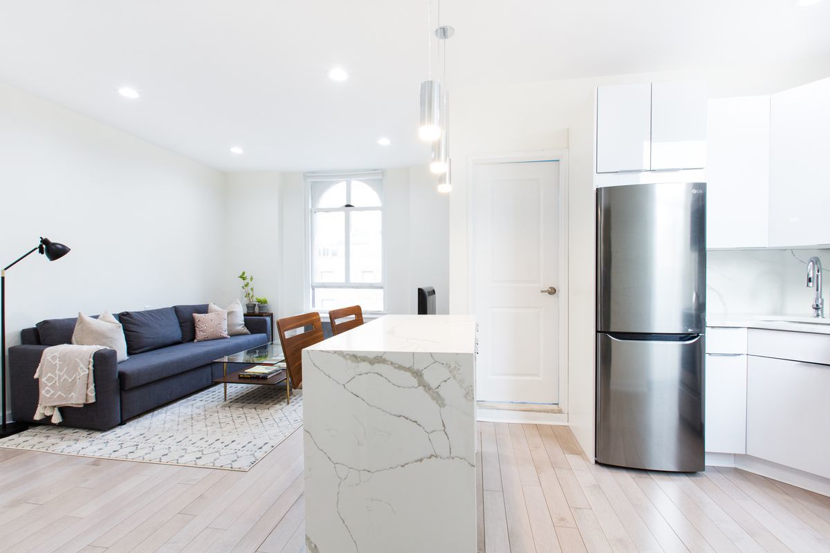 390 West End Avenue, Unit PHK Manhattan, NY 10024 - Photo 9 of 27 a living room with furniture wooden floor and white cabinets