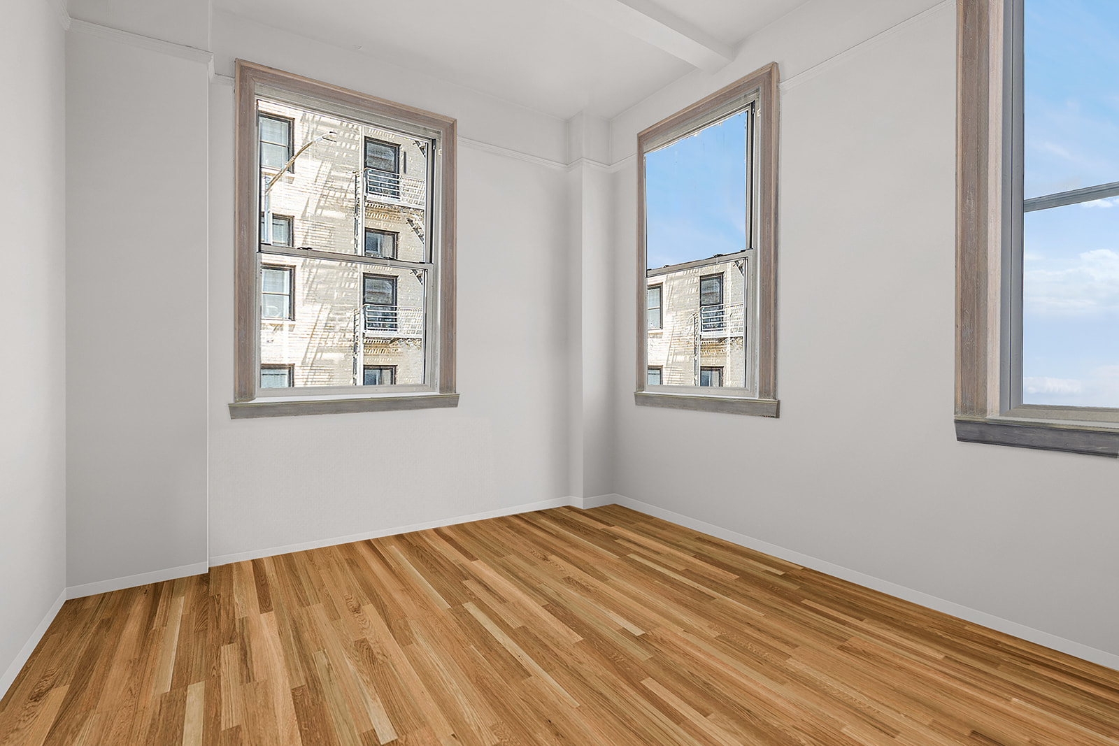 41 Eastern Parkway, Unit 1D Brooklyn, NY 11238 - Photo 9 of 16 a view of a room with wooden floor and windows