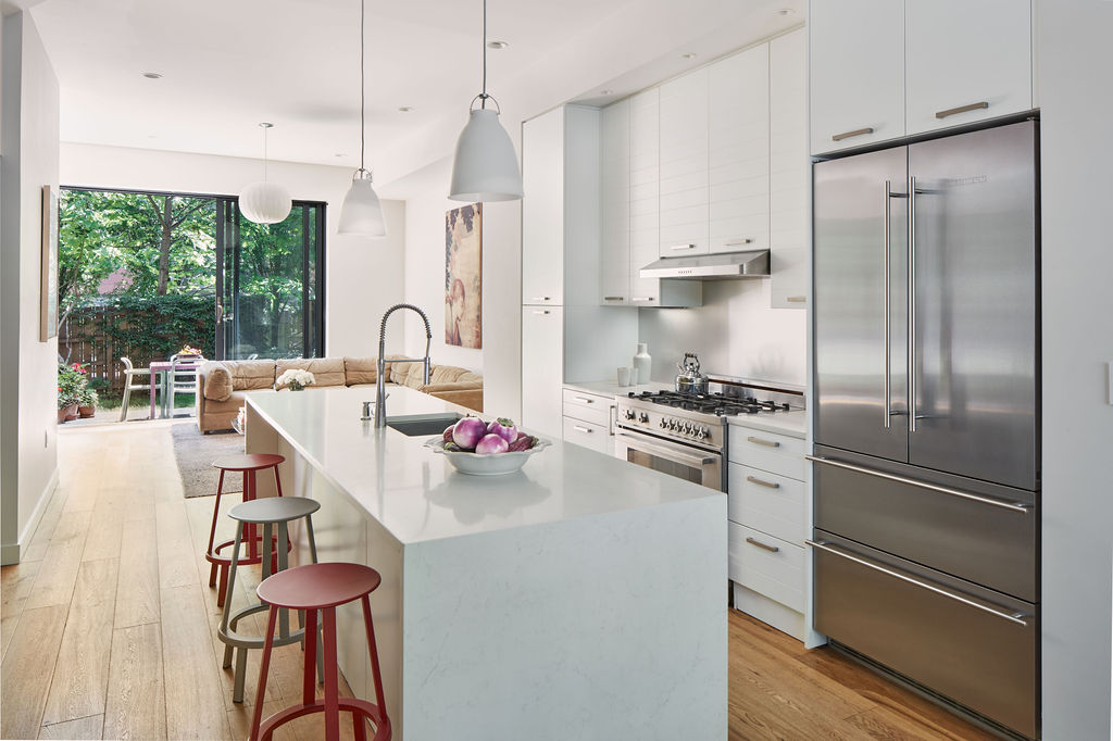 27 Clermont Avenue Brooklyn, NY 11205 - Photo 3 of 19 a kitchen with stainless steel appliances a refrigerator sink and cabinets