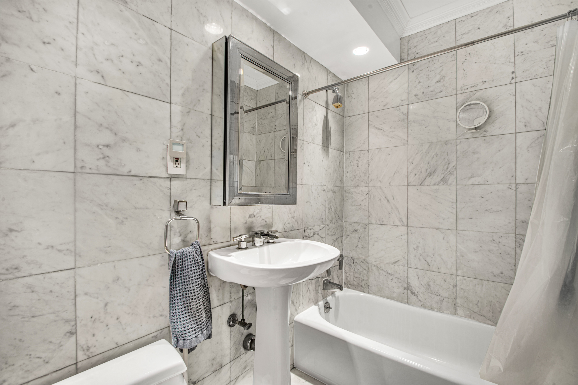 175 Adams Street, Unit 6E Brooklyn, NY 11201 - Photo 7 of 10 a bathroom with a sink shower and a bathtub