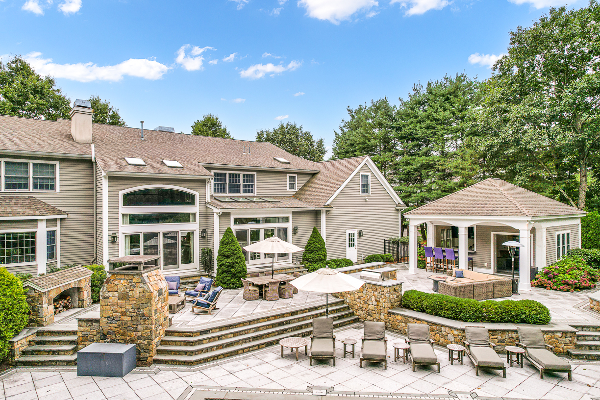 165 Bridle Trail Road Needham, MA 02492 - Photo 17 of 21 a view of house with yard furniture and fire pit