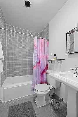 604 Riverside Drive, Unit 4E Manhattan, NY 10031 - Photo 5 of 8 a bathroom with a toilet a sink and a bathtub