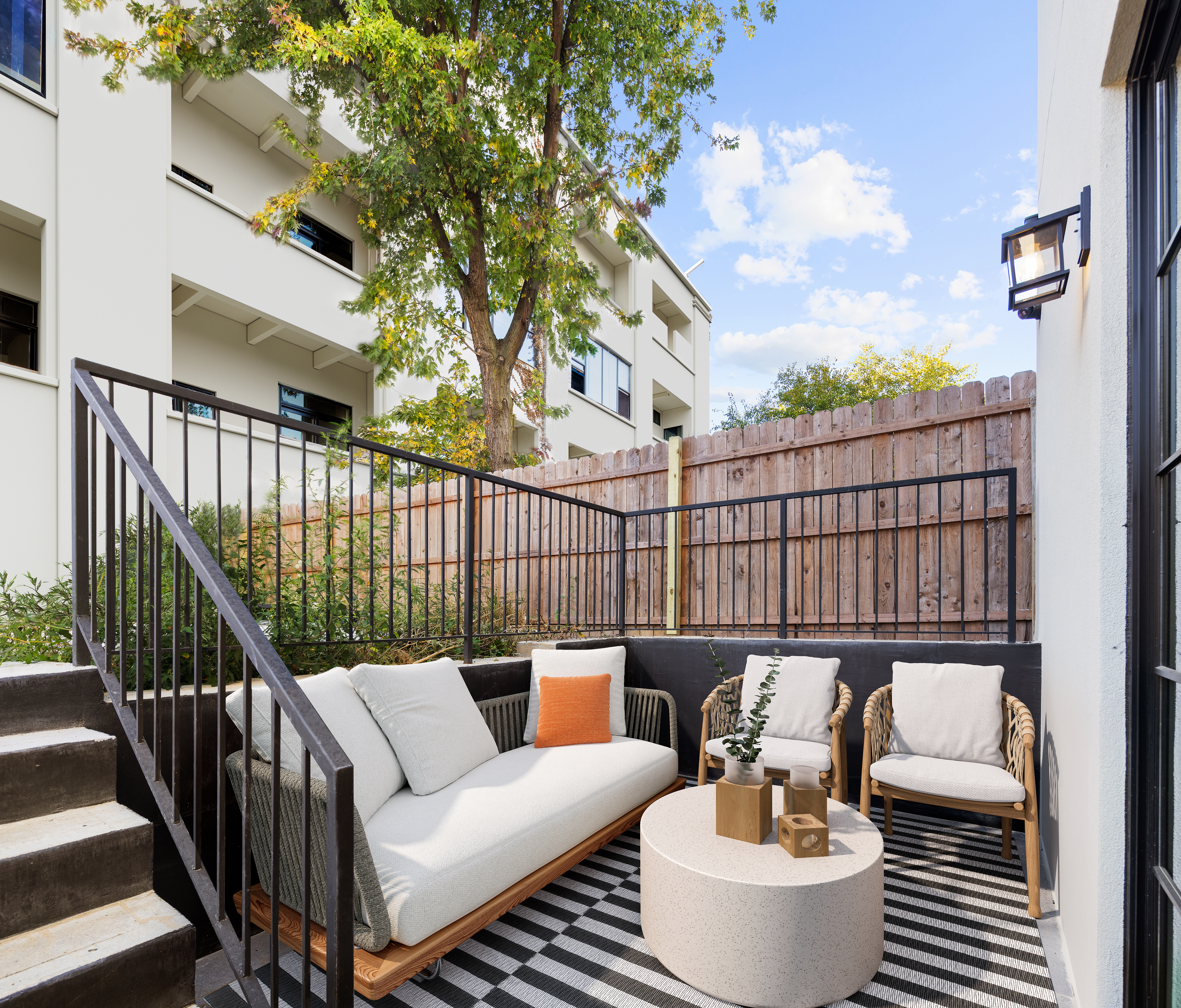 262 17th Street, Unit GARDEN Brooklyn, NY 11215 - Photo 6 of 8 a roof deck with couches and wooden fence