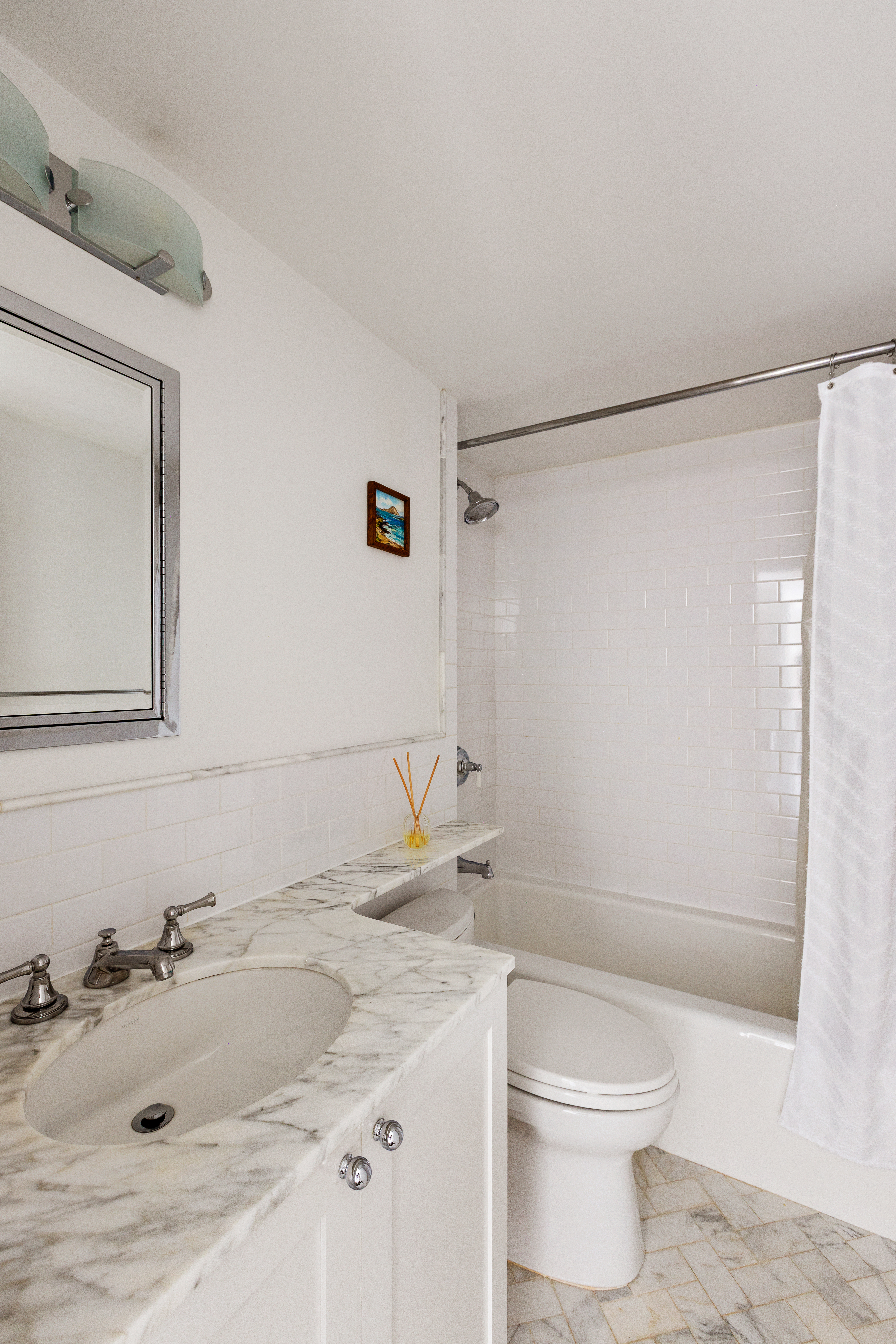 2 5th Avenue, Unit 5F Manhattan, NY 10011 - Photo 5 of 9 a bathroom with a granite countertop sink toilet and shower