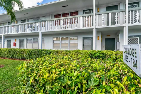 a front view of a house with a lots of windows