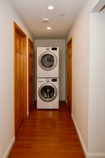 a view of a hallway with washer and dryer
