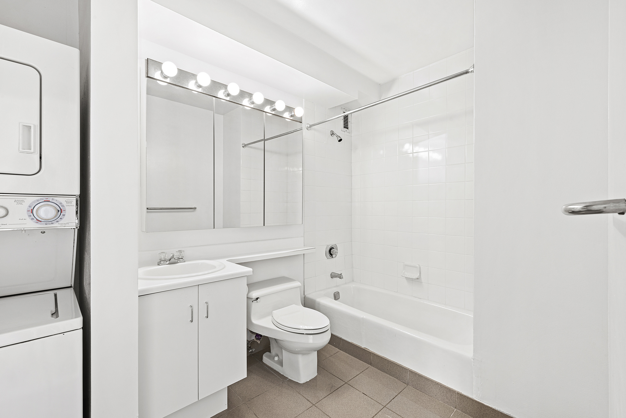 2250 Broadway, Unit 6K Manhattan, NY 10024 - Photo 9 of 15 a bathroom with a sink a toilet and shower