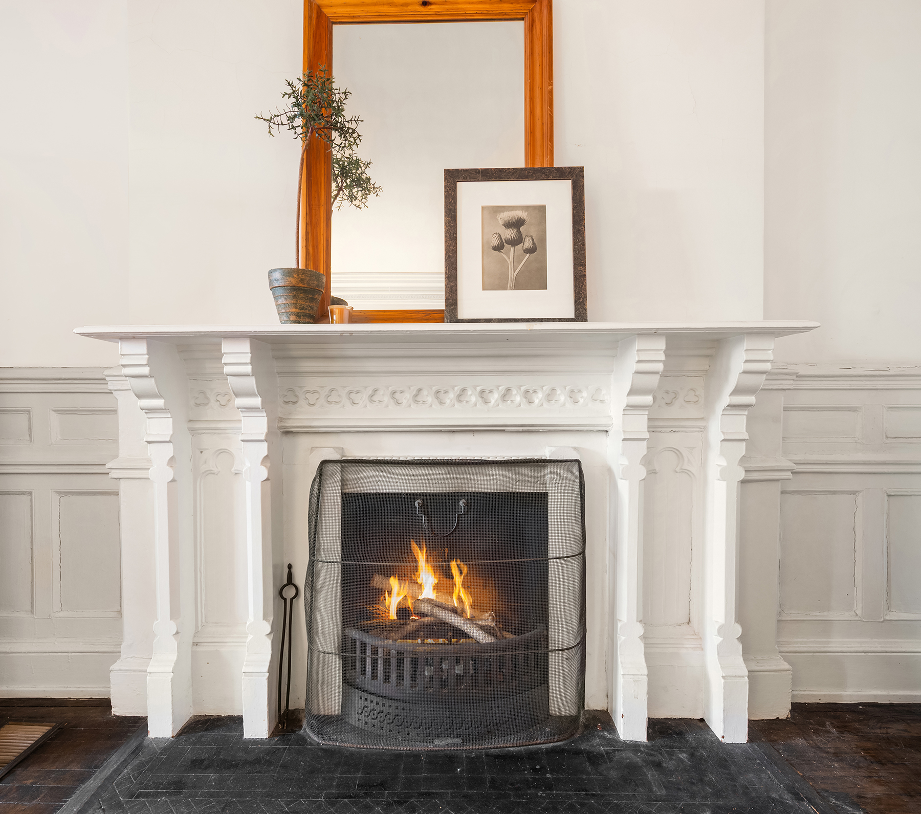 64 East 80th Street Manhattan, NY 10075 - Photo 7 of 14 a living room with a fireplace and a wooden floor