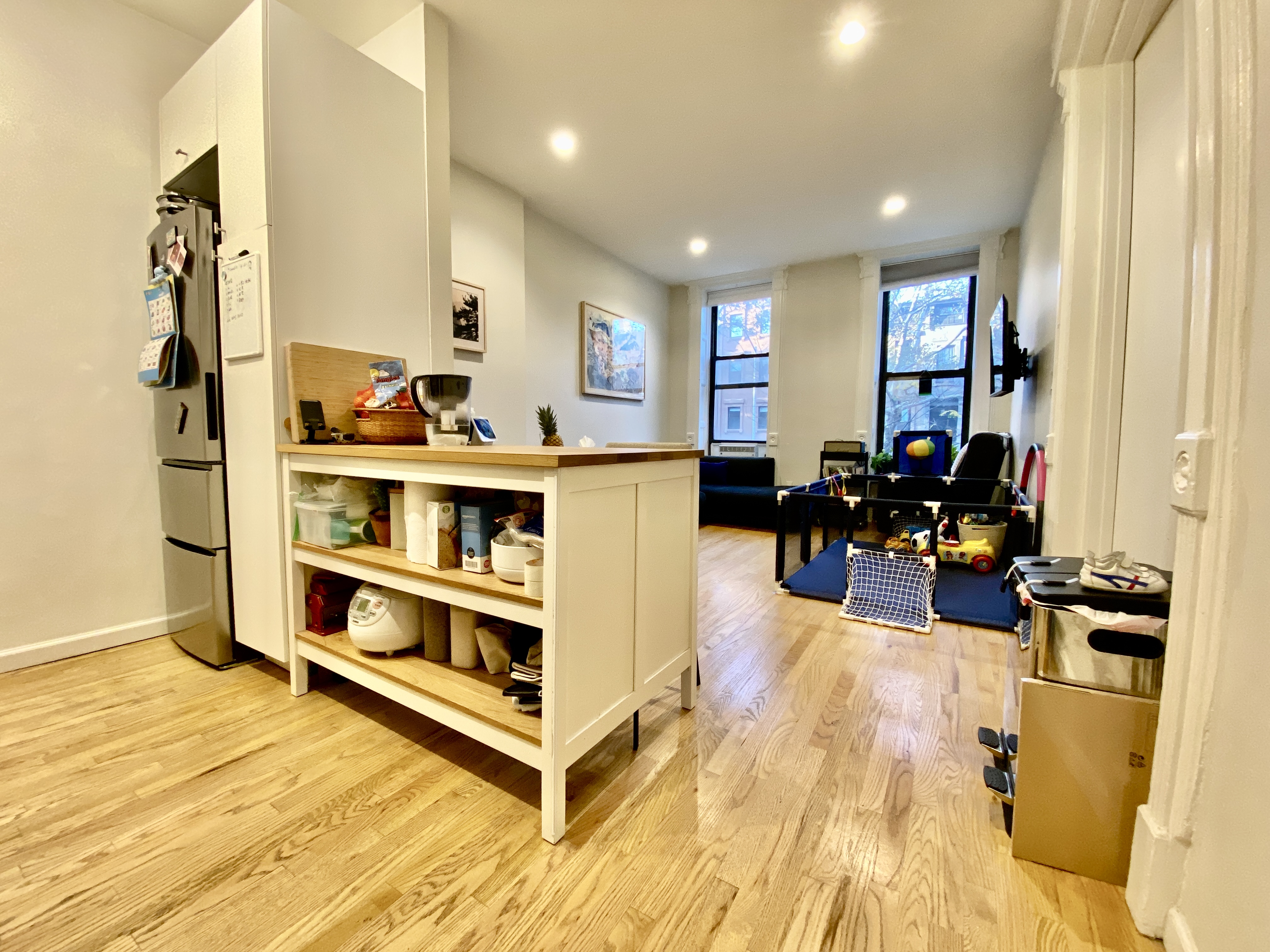 602 Madison Street, Unit 2 Brooklyn, NY 11221 - Photo 5 of 10 a living room with furniture and a large window