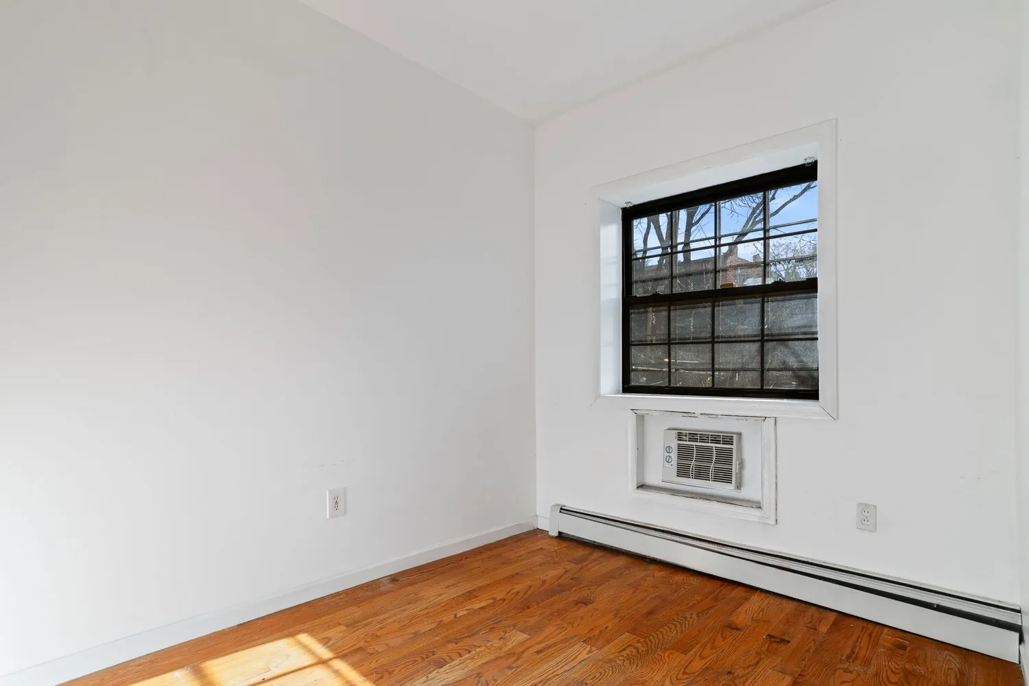 a view of an empty room and window
