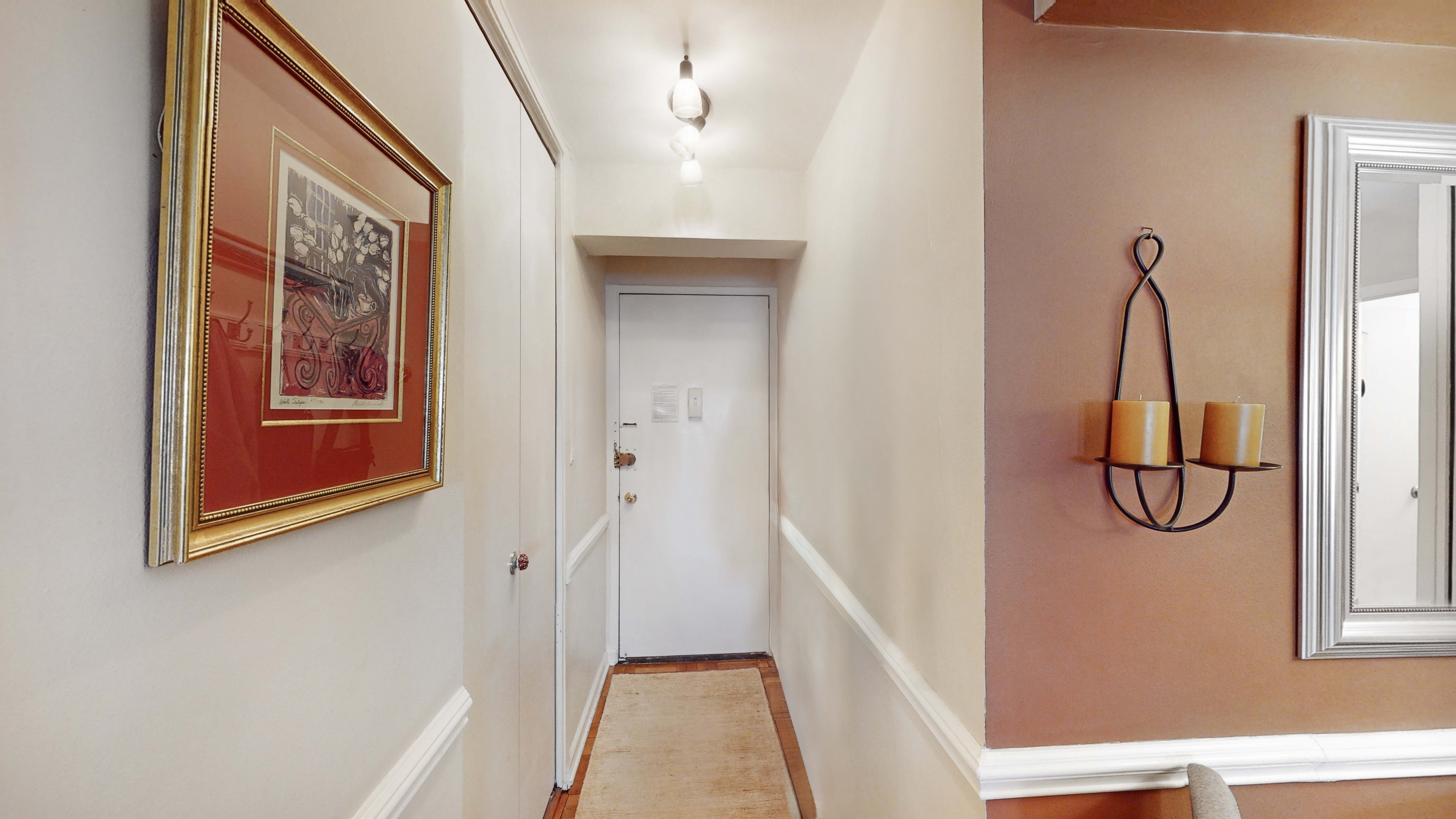 515 East 85th Street, Unit 6A Manhattan, NY 10028 - Photo 8 of 11 a view of a room with rack on the wall and a window