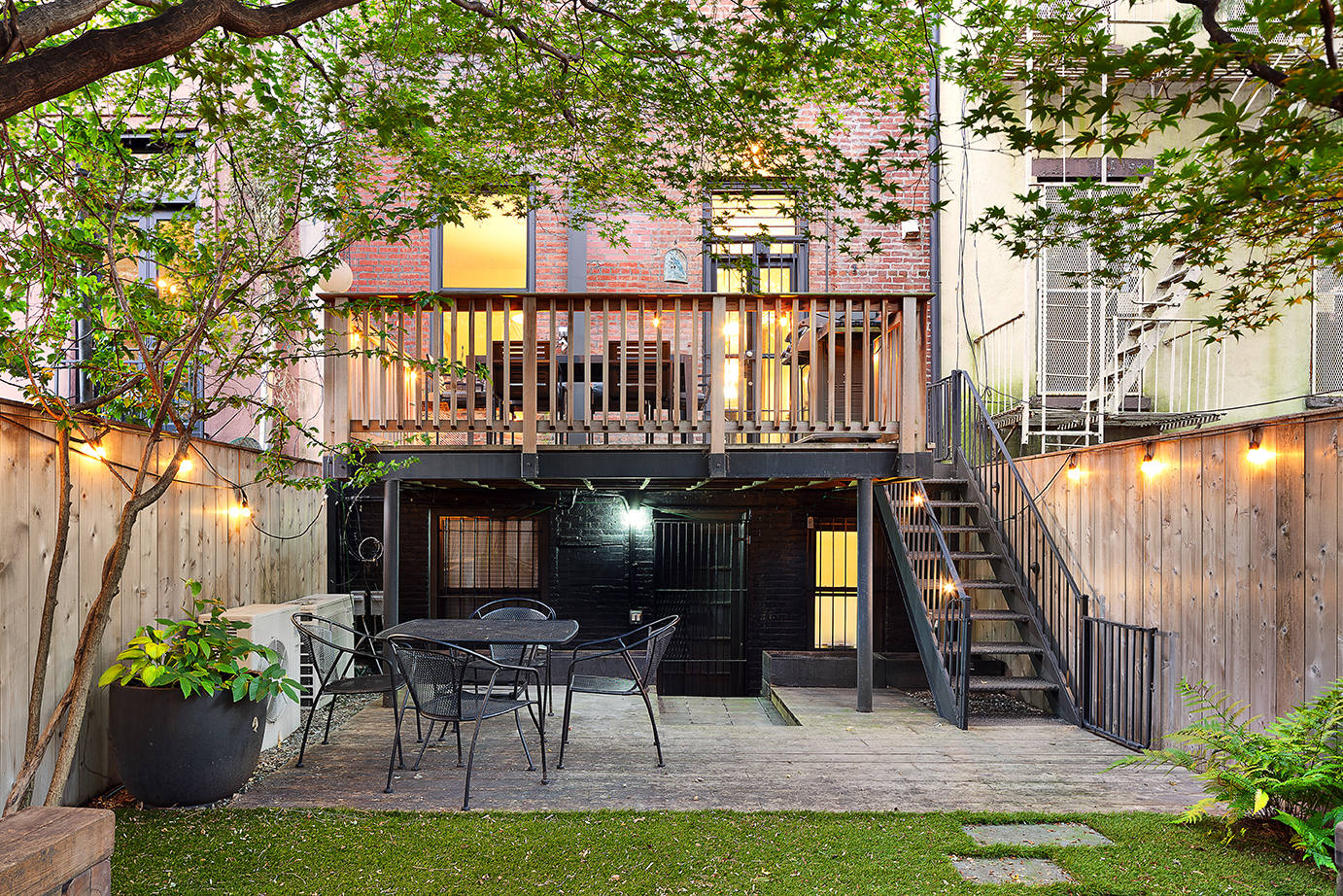 355 Pacific Street Brooklyn, NY 11217 - Photo 11 of 13 a view of a chair and table in backyard of the house