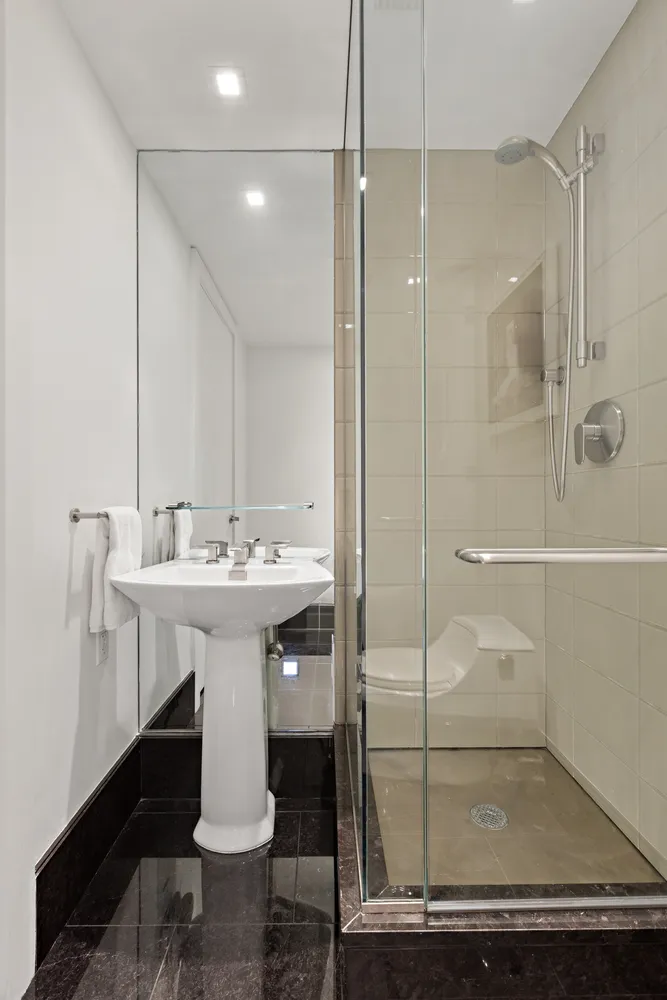 a bathroom with a sink and mirror