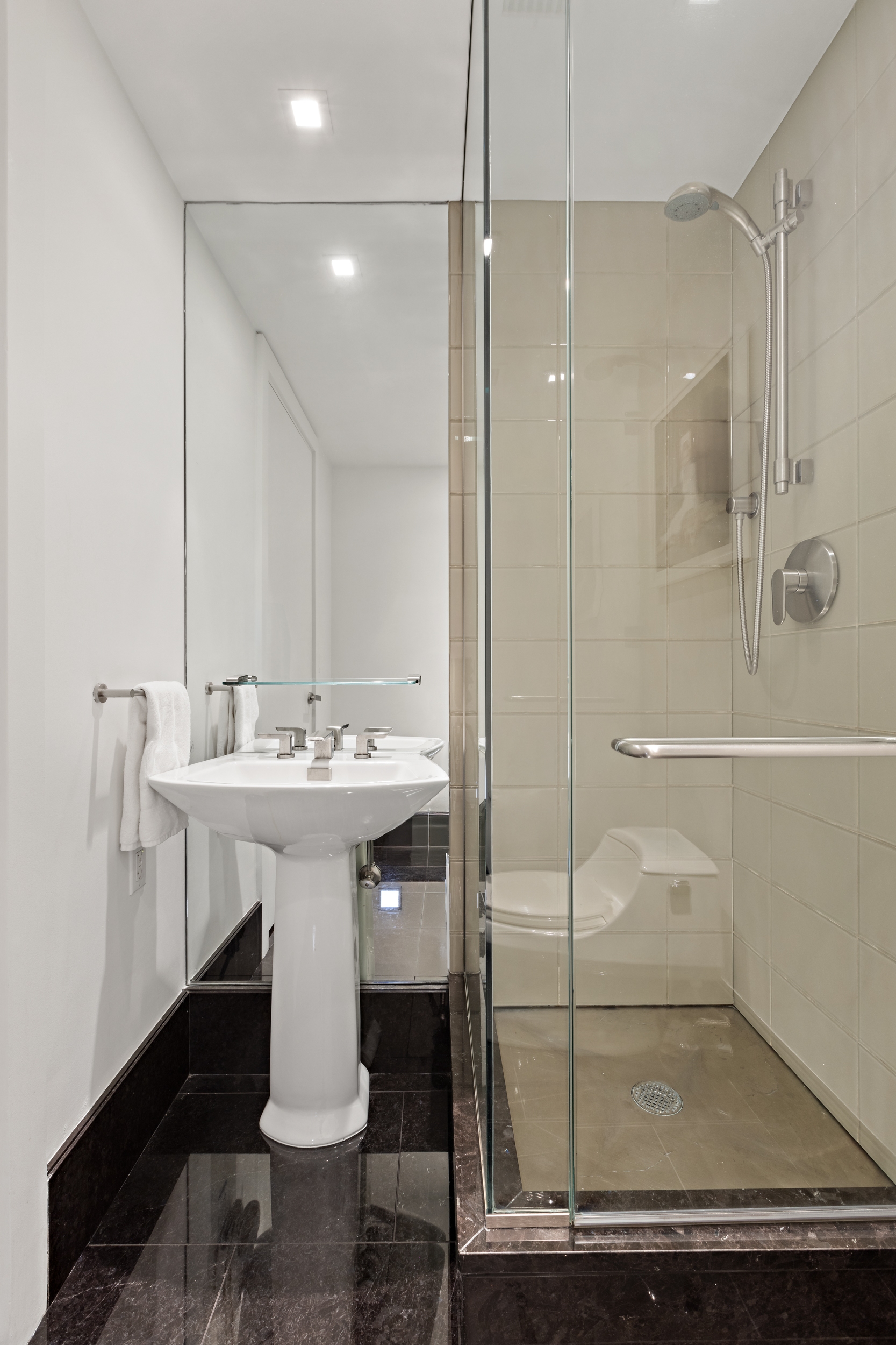 400 West 12th Street, Unit 3F Manhattan, NY 10014 - Photo 7 of 15 a bathroom with a sink and mirror