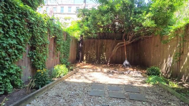 49 Saint Marks Avenue, Unit 1 Brooklyn, NY 11217 - Photo 4 of 21 a view of a backyard with tree
