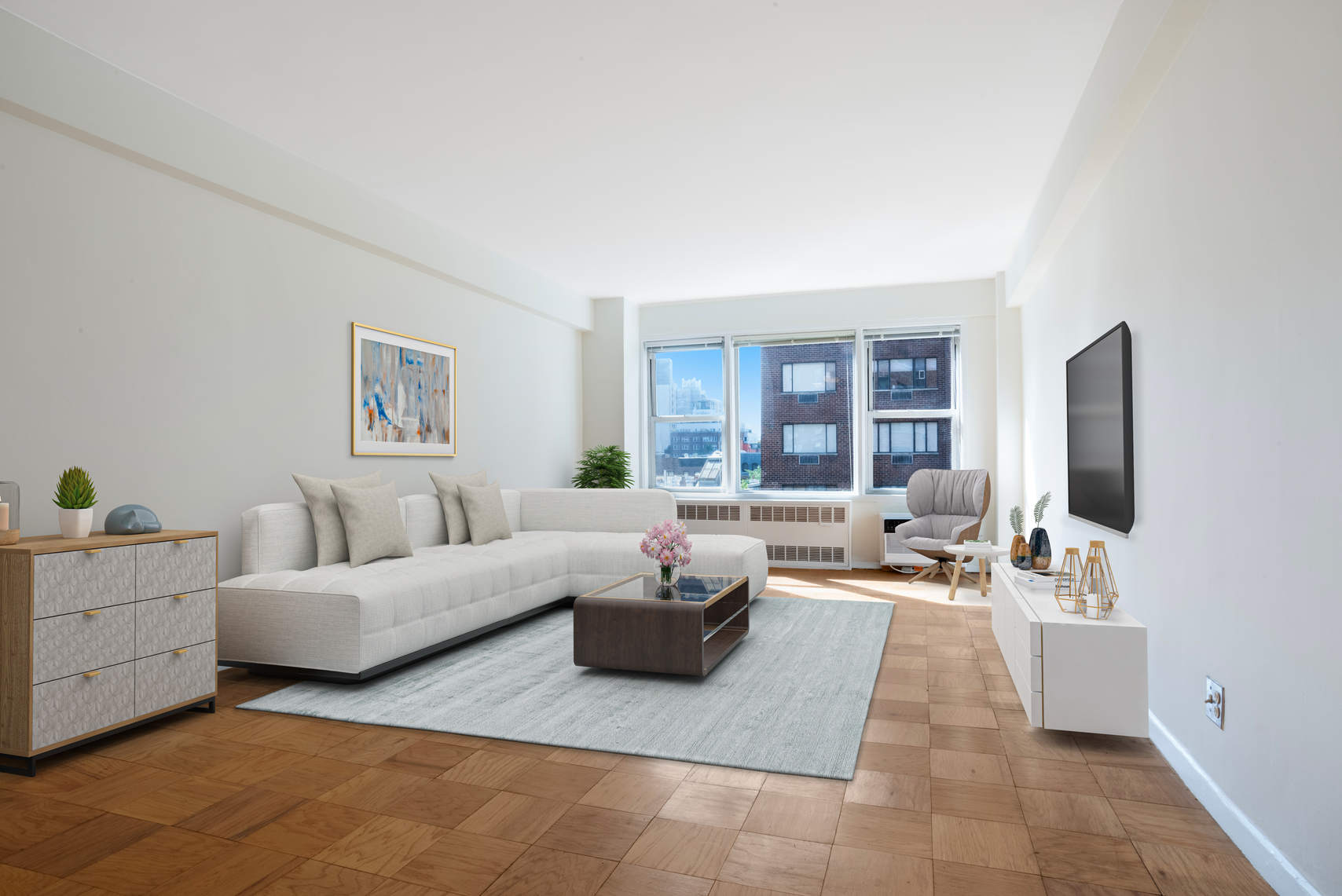 515 East 85th Street, Unit 8C Manhattan, NY 10028 - Photo 1 of 10 a living room with furniture and a flat screen tv