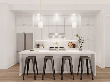 a white kitchen with a table and chairs