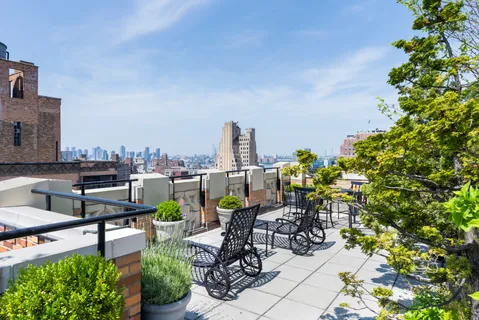 a view of a chairs and table in a patio