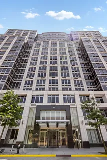 a living room with couches a table and chairs