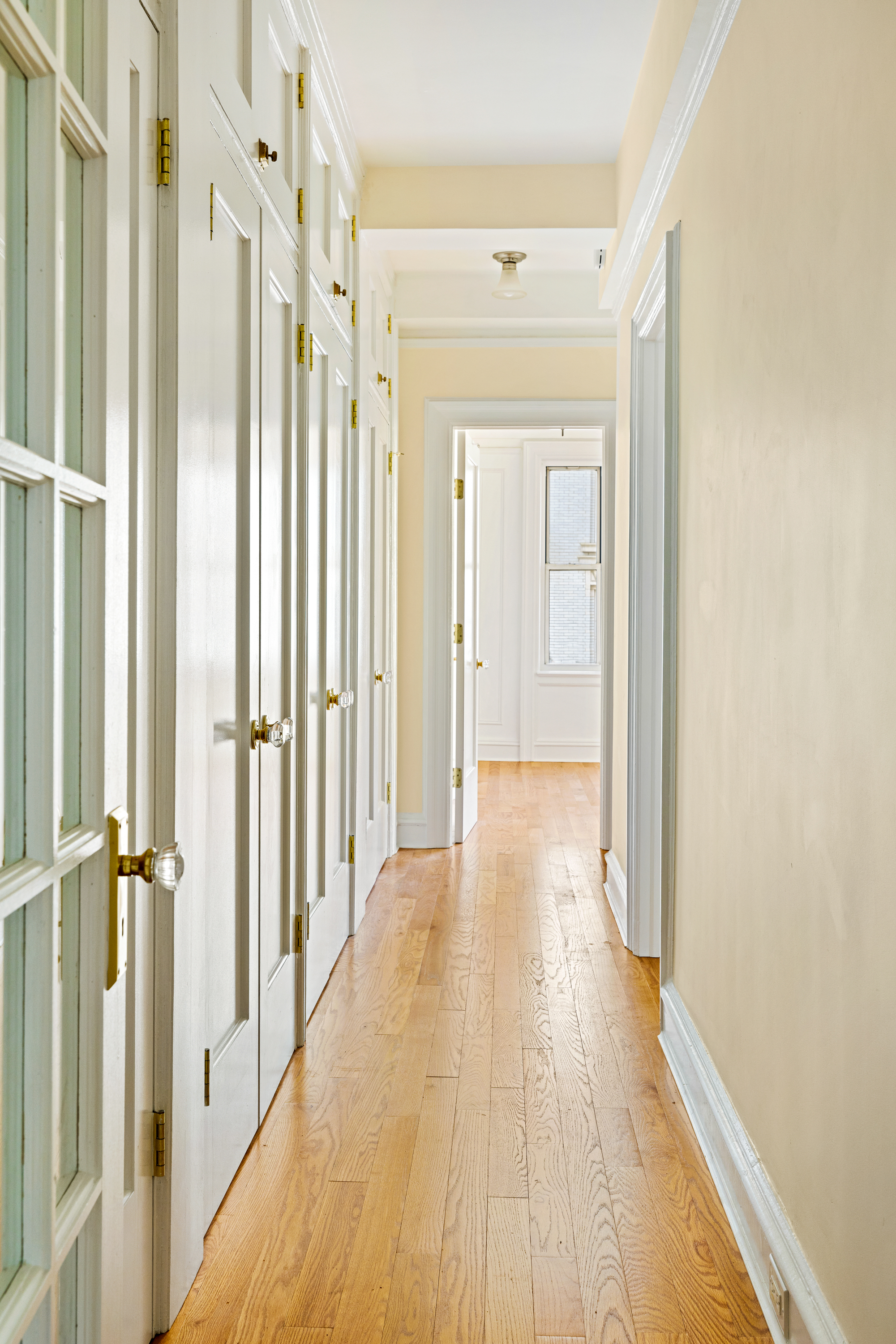 240 West 98th Street, Unit 7D Manhattan, NY 10025 - Photo 5 of 14 a view of a hallway with wooden floor and staircase