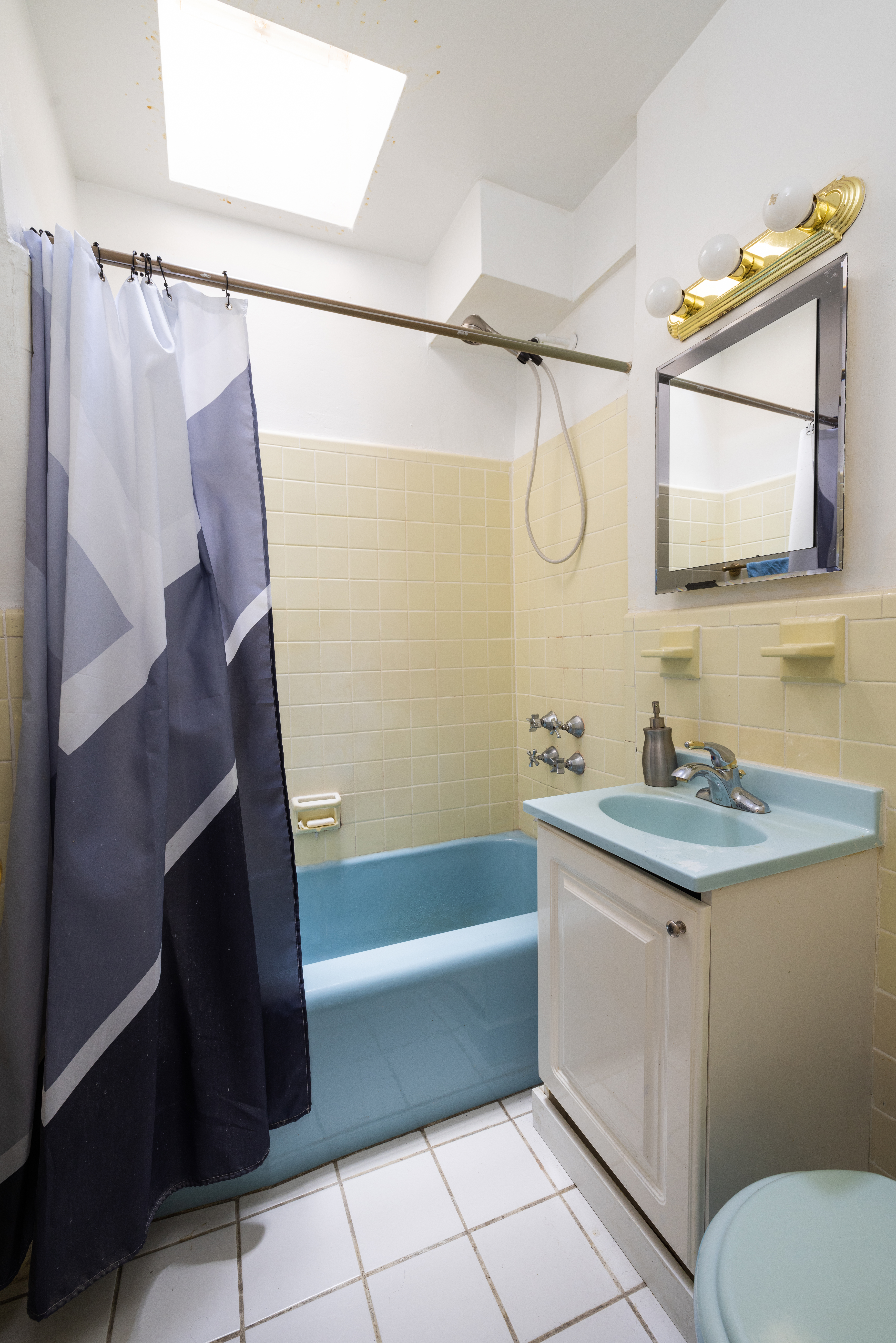 321 East 71st Street, Unit 5E Manhattan, NY 10021 - Photo 4 of 6 a bathroom with a granite countertop sink a toilet and shower